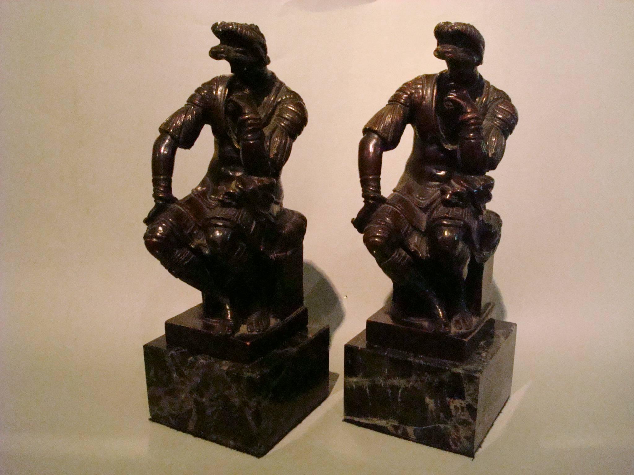 This fine work Bronze Bookends made after the original statue by Michelangelo at the tomb of Lorenzo Di Medici, Duke of Urbino, Medici Chapel of San Lorenzo, Firenze. Medici is cast as a Roman General in repose on a square pedestal, his head