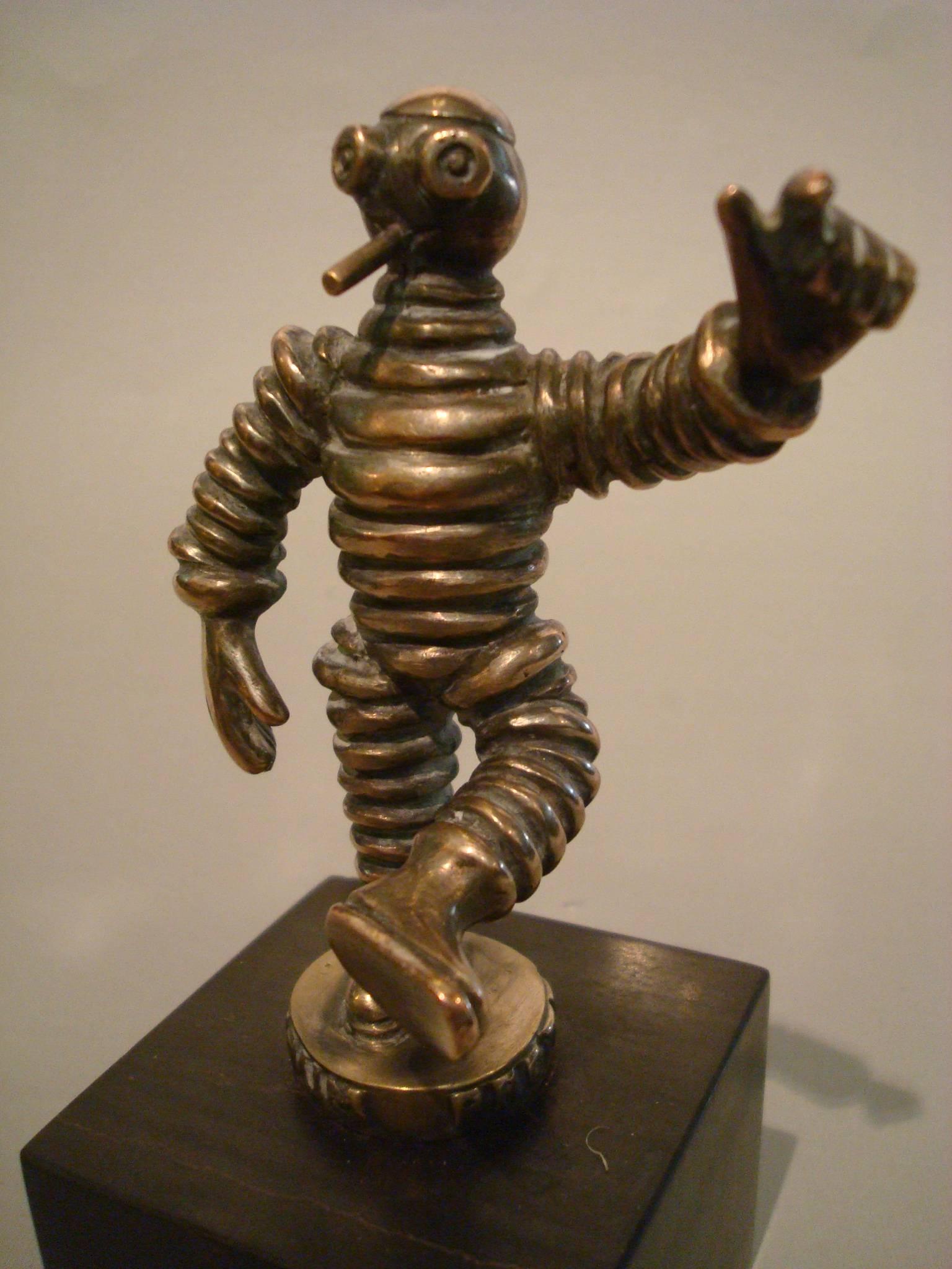An early 'Bibendum Protégé' Car mascot - Hood Ornament, French, circa 1910,
nickel-plated bronze figure of a 'slim' Mr. Bibendum, mounted on marble base. Perfect for any Classic car or vintage Automobilia collector. Looks great as a paperweight.