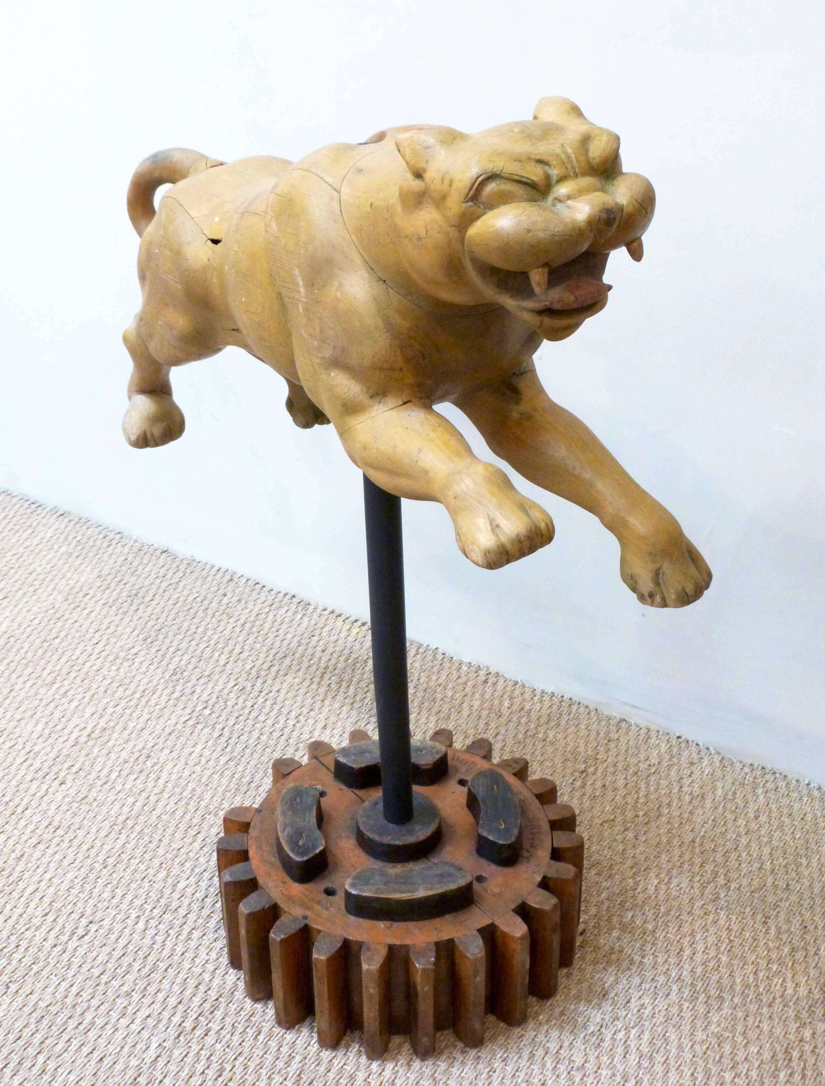 A 20th century large carved and painted stylized leaping Puma, circa 1940.
Possibly an advertising or fairground sculpture, raised on later stand.
     