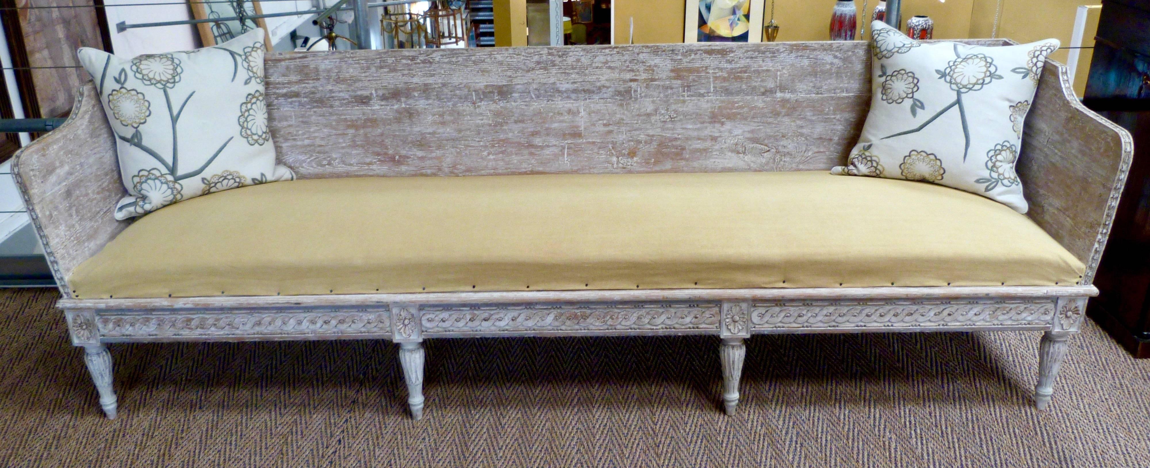 A late 18th century Swedish bench with scraped back paint.