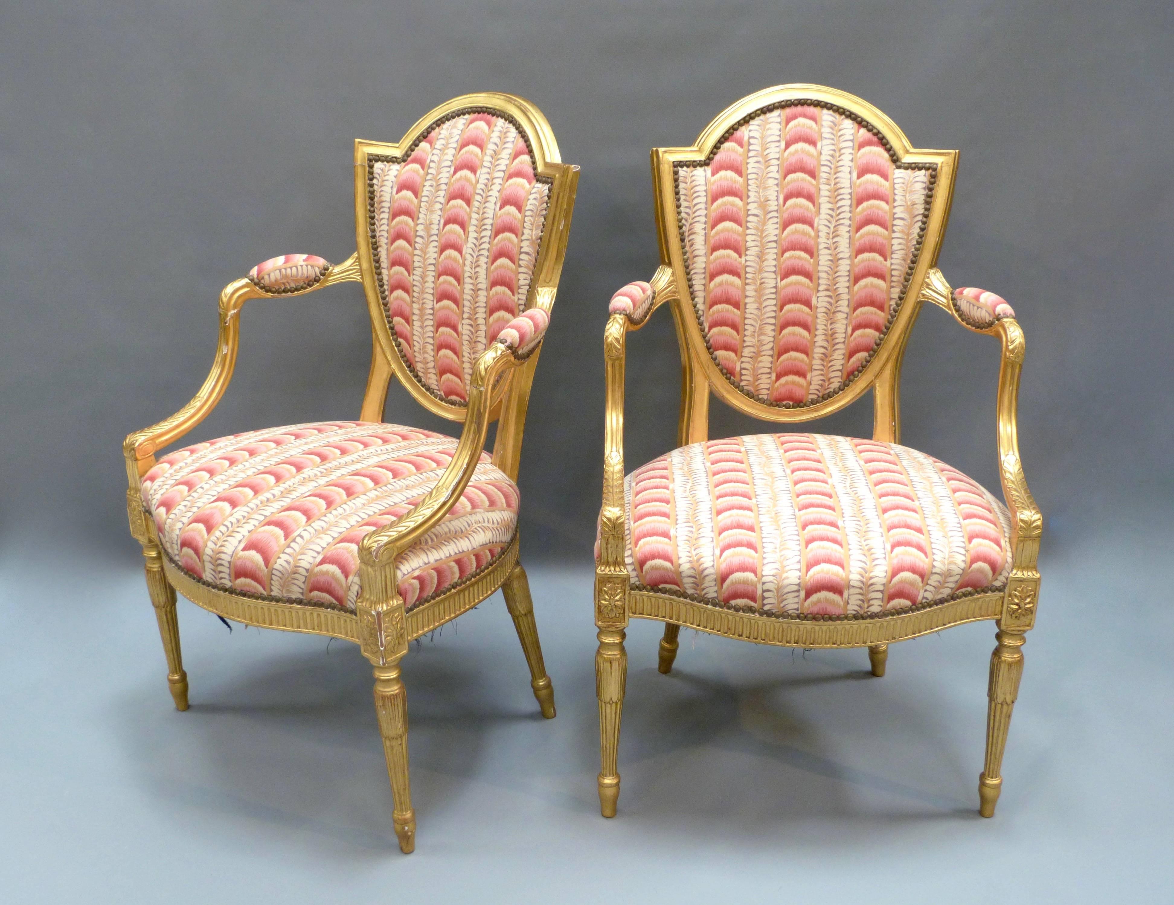 A good set of six giltwood dining chairs in the style of Robert Adam.