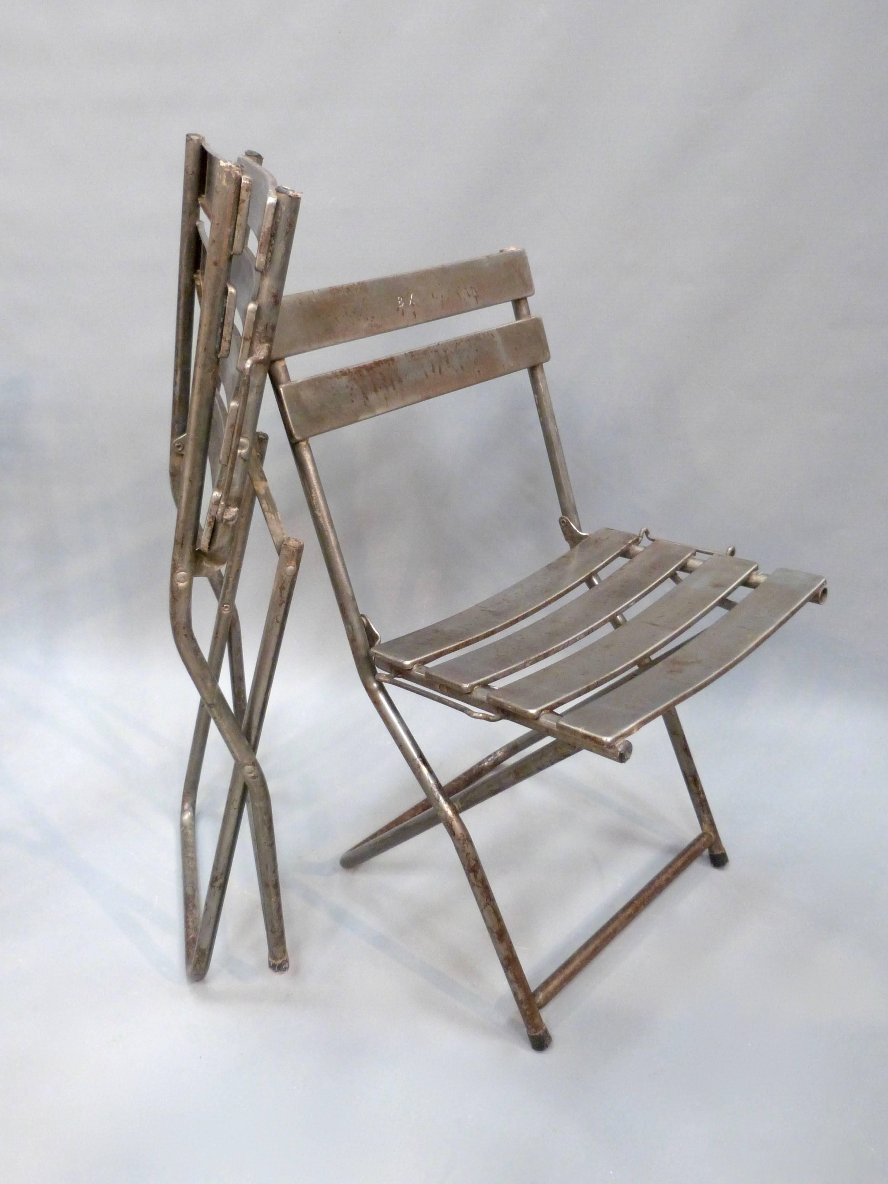 Industrial Set of Eight French Folding Steel Chairs For Sale