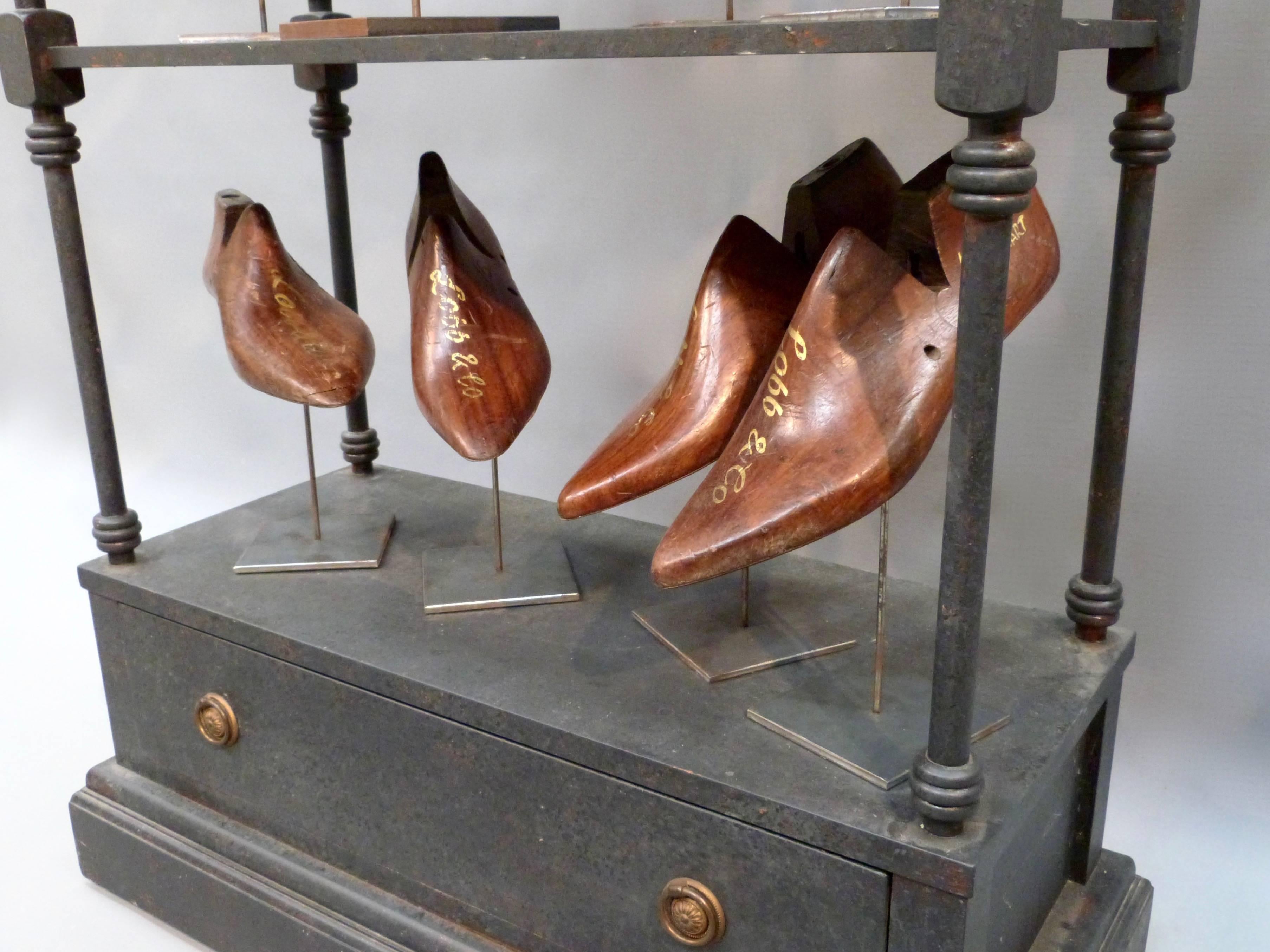 A collection of eight pairs and a single Lobb & Co. shoe moulds on a display stand.
In the middle of the 19th century, John Lobb, a farmer's son, crippled as the result of an accident, made his way on foot from Cornwall to London. He was