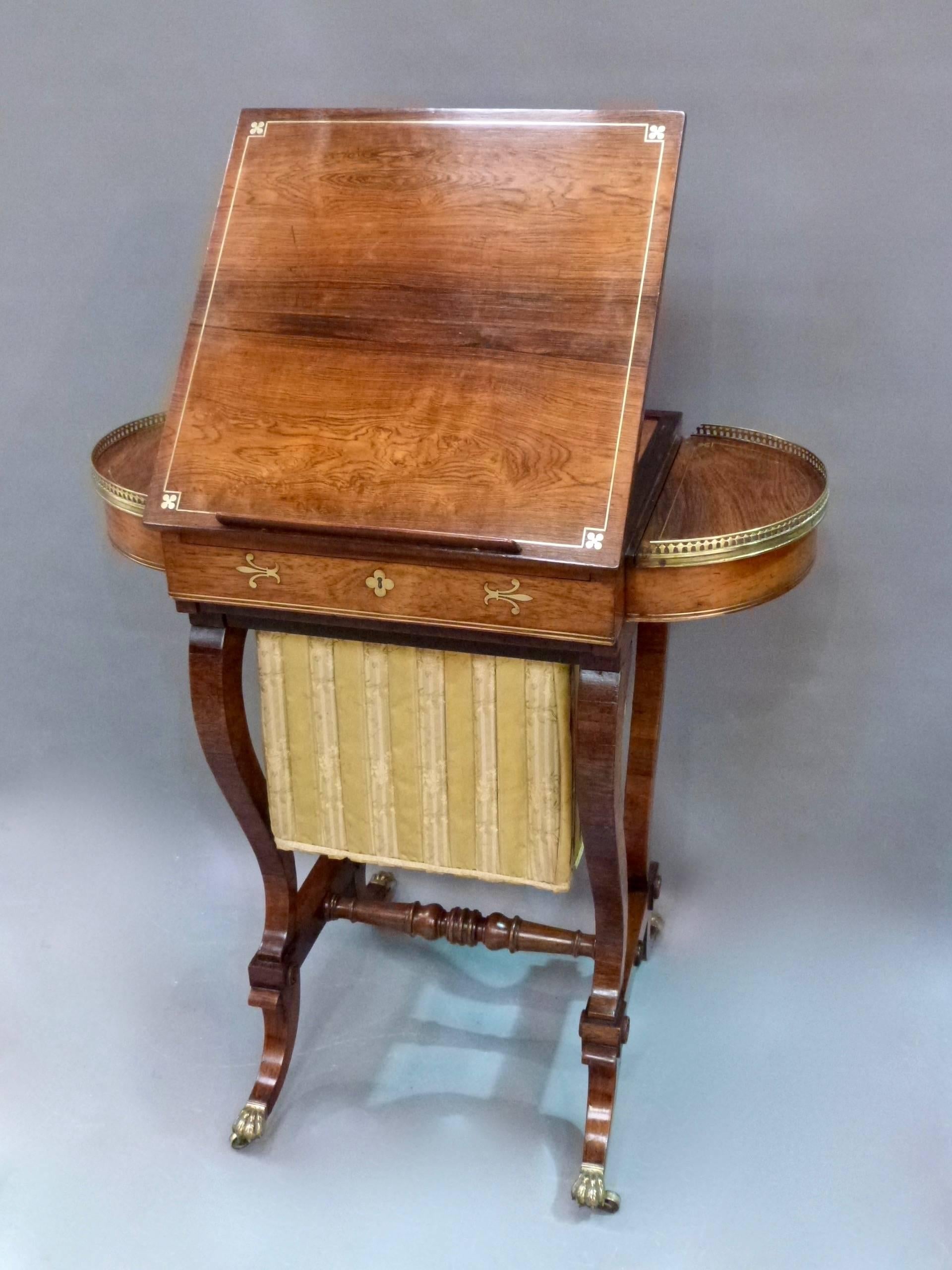 A fine Regency rosewood brass inlaid occasional table with chess board, backgammon board, cribbage board, sewing bag, reading stand on splayed
legs.