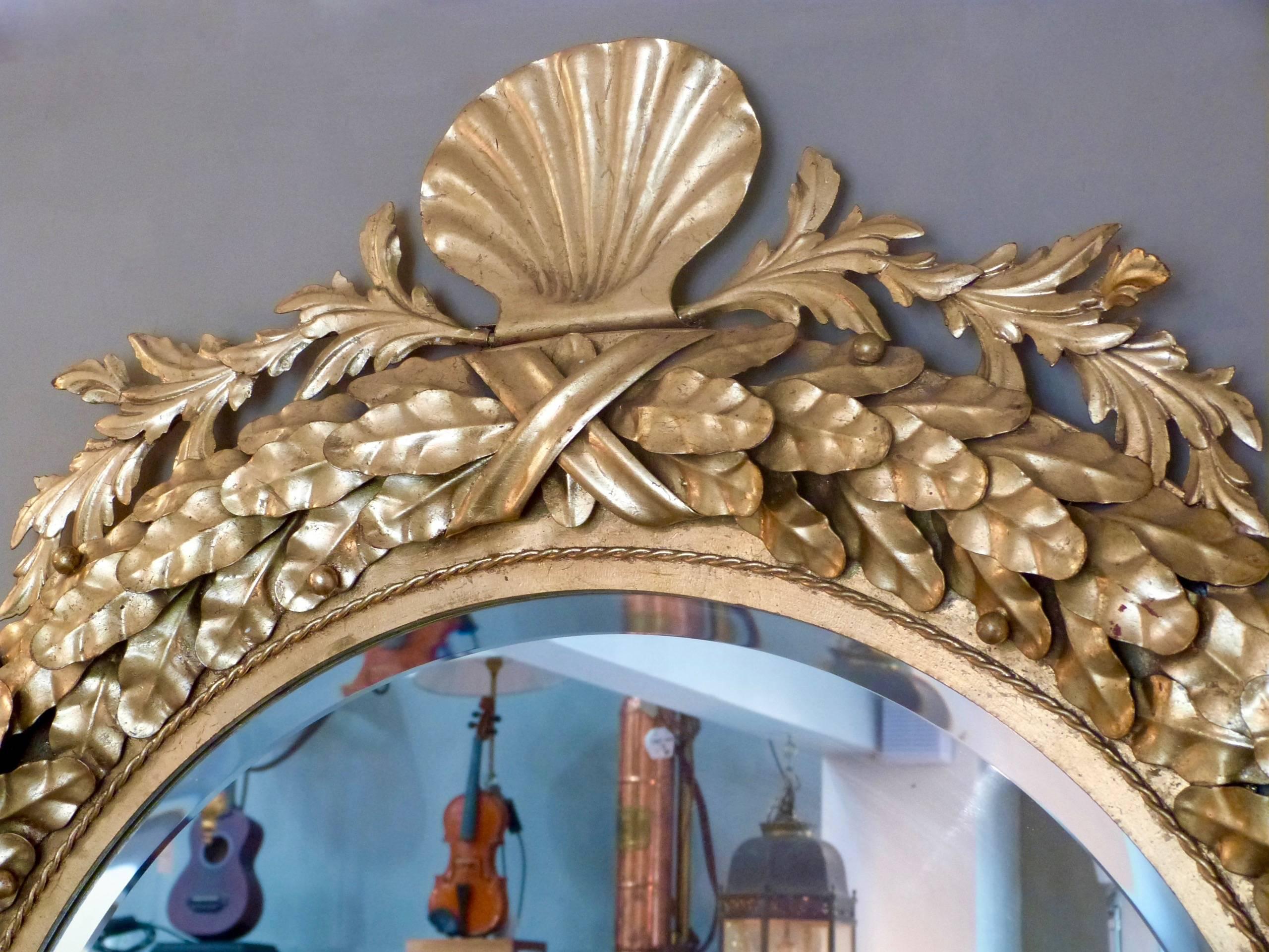 A pair of late 20th century gilt metal mirrors.
