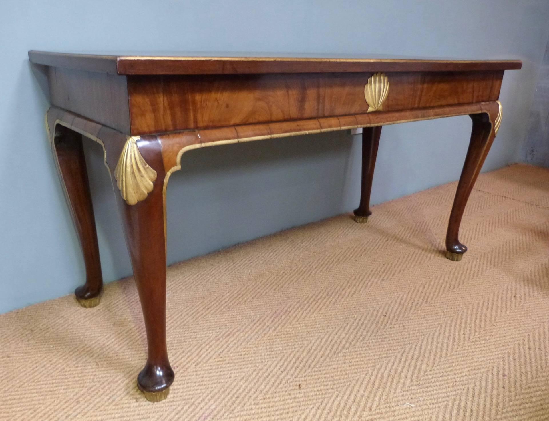 A George II style console table with parcel-gilt decoration, circa 1880.