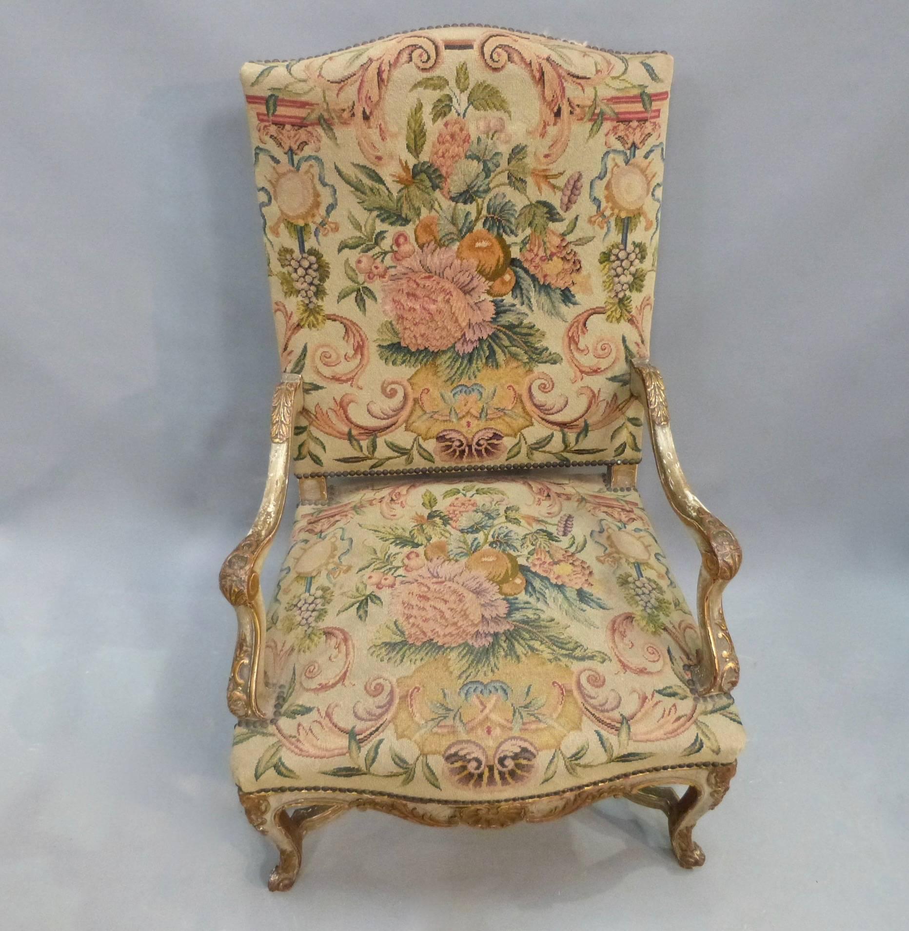A pair of 19th century French painted and gilt armchairs with original tapestry upholstery, circa 1850.