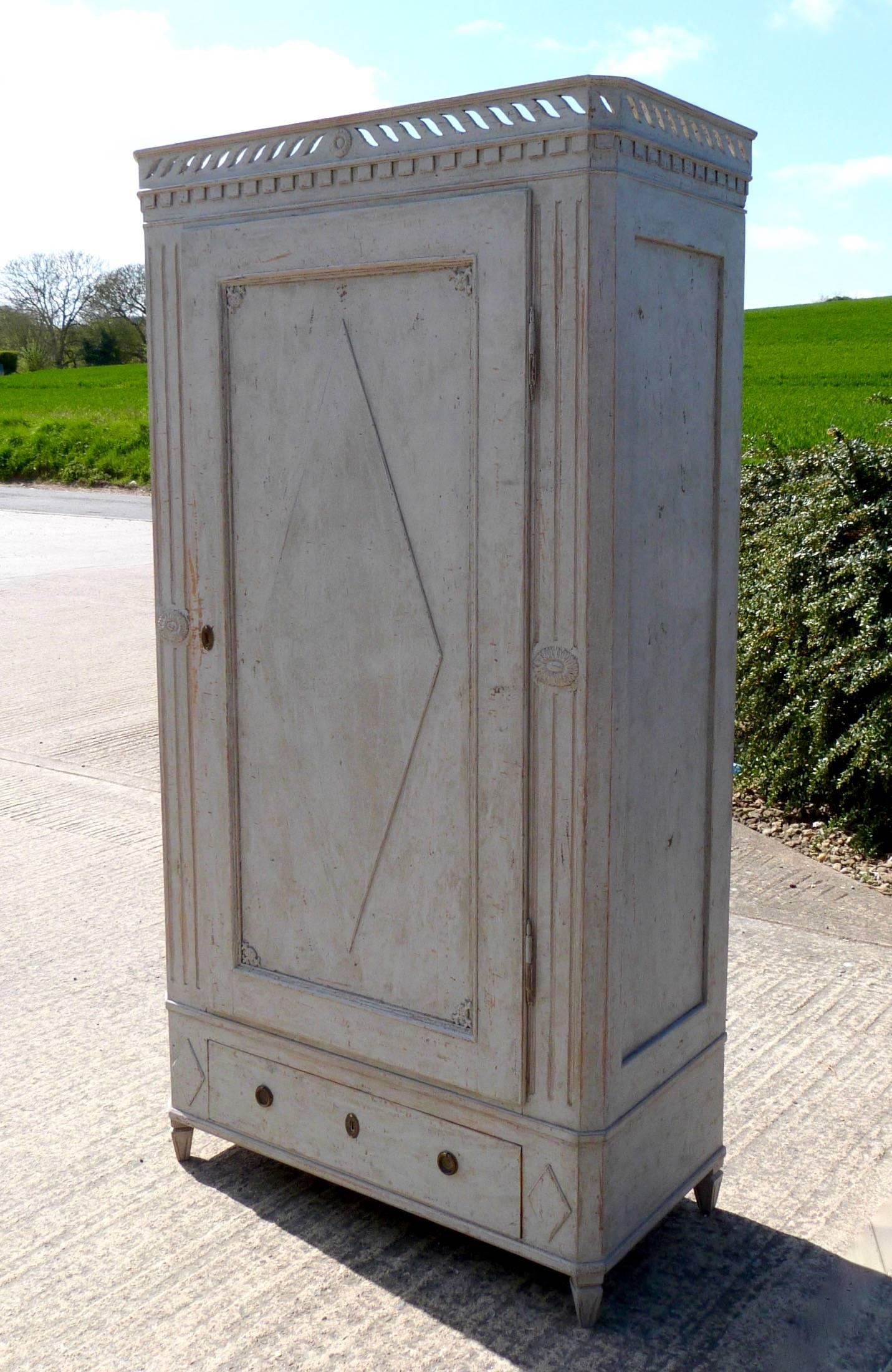 A Swedish painted Gustavian style cupboard.