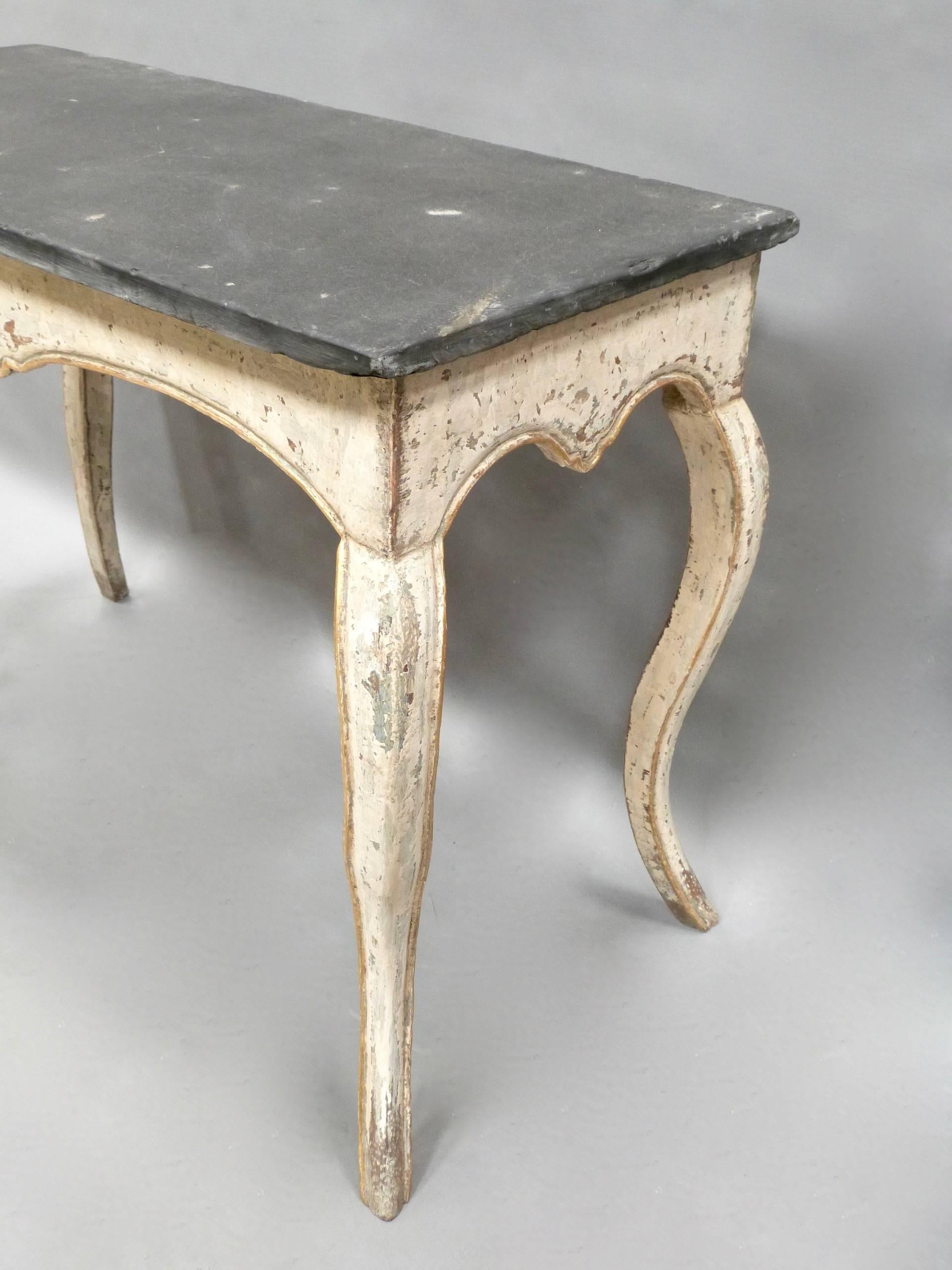 A pair of French late 19th century painted tables with slate tops.