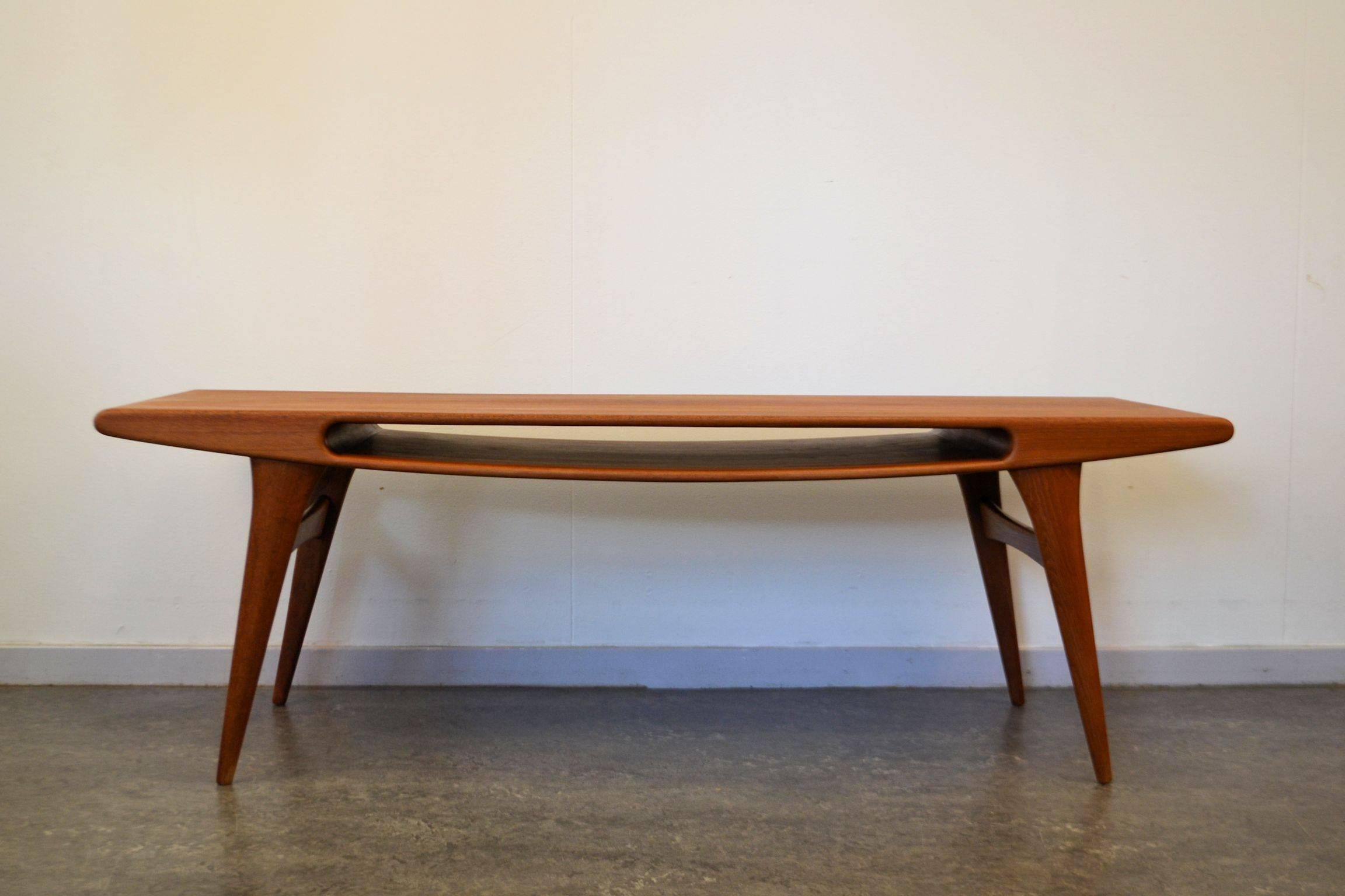 Absolutely stunning Danish modern “Smile” coffee table. This unique design adds an instant “wow