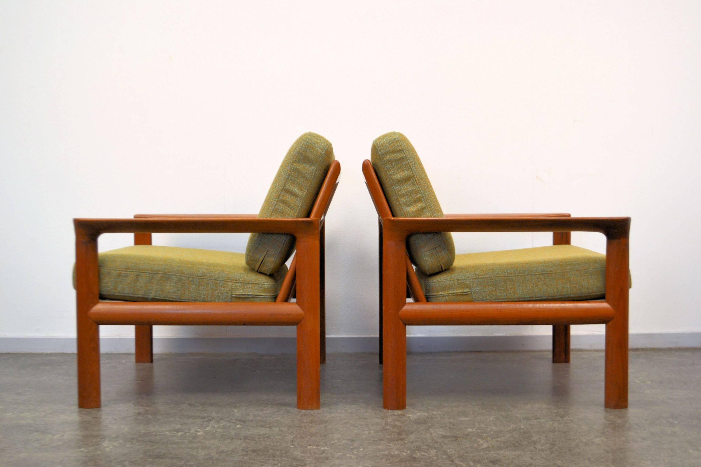 Stylish Danish modern design easy chairs designed in the 1960s by Sven Ellekaer for manufacturer Komfort. Featuring characteristic Danish modern design and quality, solid teak frames and easy to remove new upholstery. Create a stunning vintage