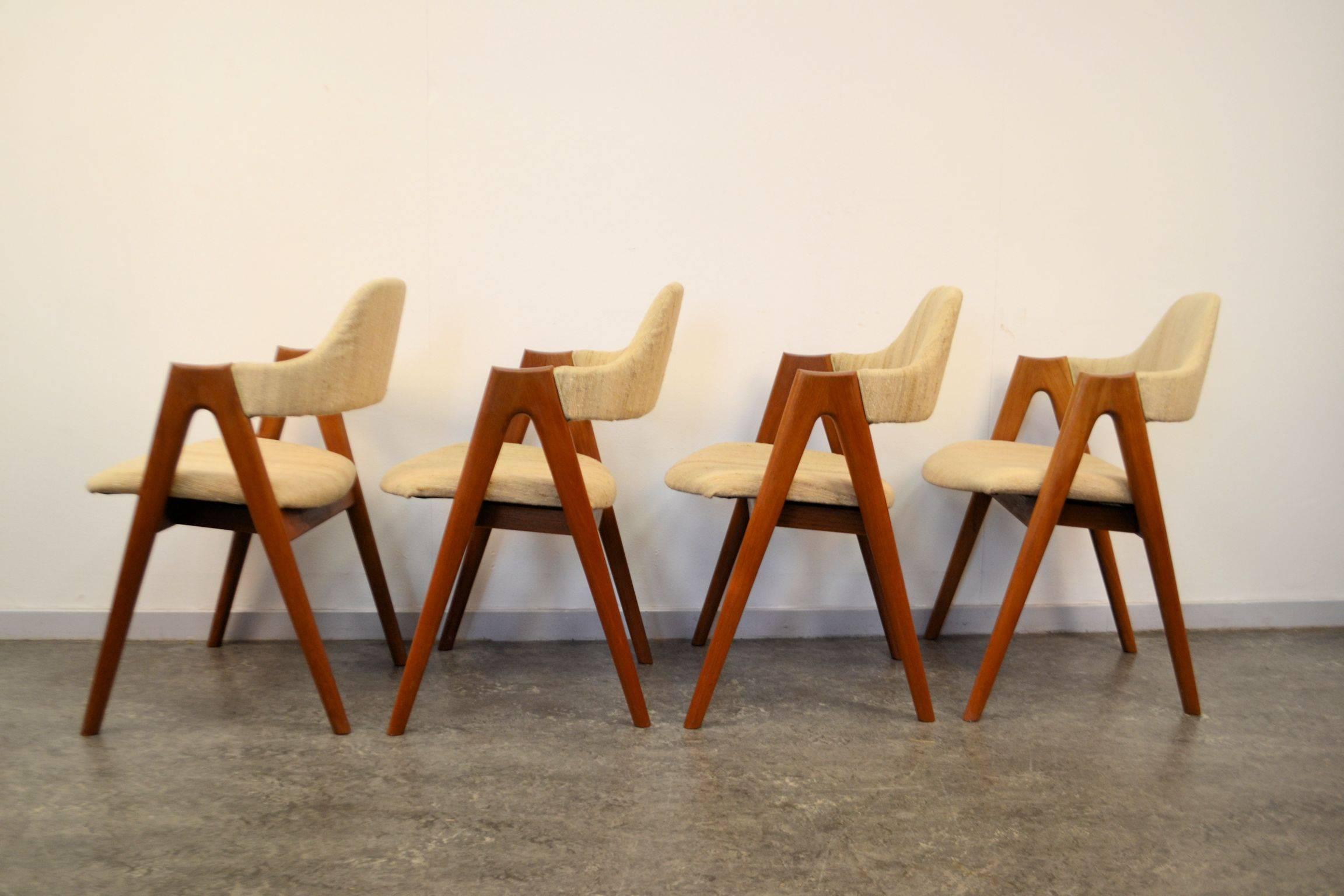 Danish modern “Compass” dining chairs designed by Kai Kristiansen for SVA Møbler, Denmark. Kristiansen’s designs are well-known representative examples of Danish, mid-20th century furniture.
These solid teak chairs feature a unique design,