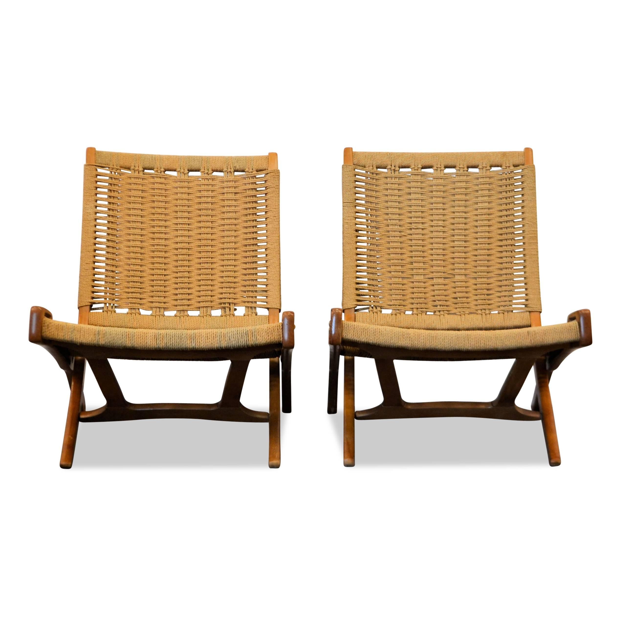 Mid-Century Modern Wegner style folding lounge chairs designed by English designer Ebert Wels. These super stylish low profile chairs are made of beautiful teak wood and woven cord. The design is very similar to the Hans J. Wegner model PP-512