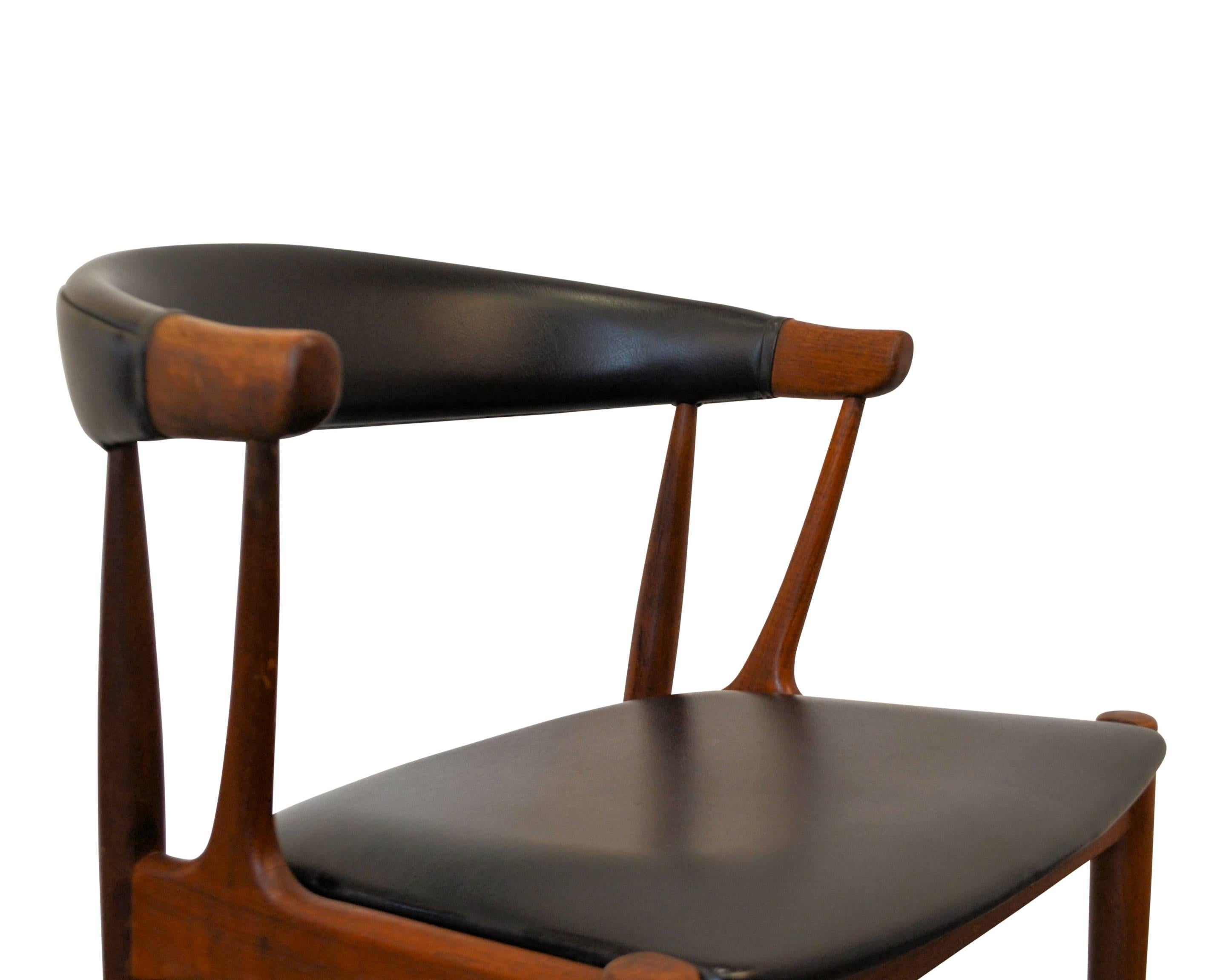 Set of four Danish modern dining chairs designed in the 1960s by worldwide known and appreciated furniture designer Johannes Andersen. His designs are considered high end Danish modern design. These chairs feature Andersen’s characteristic organic