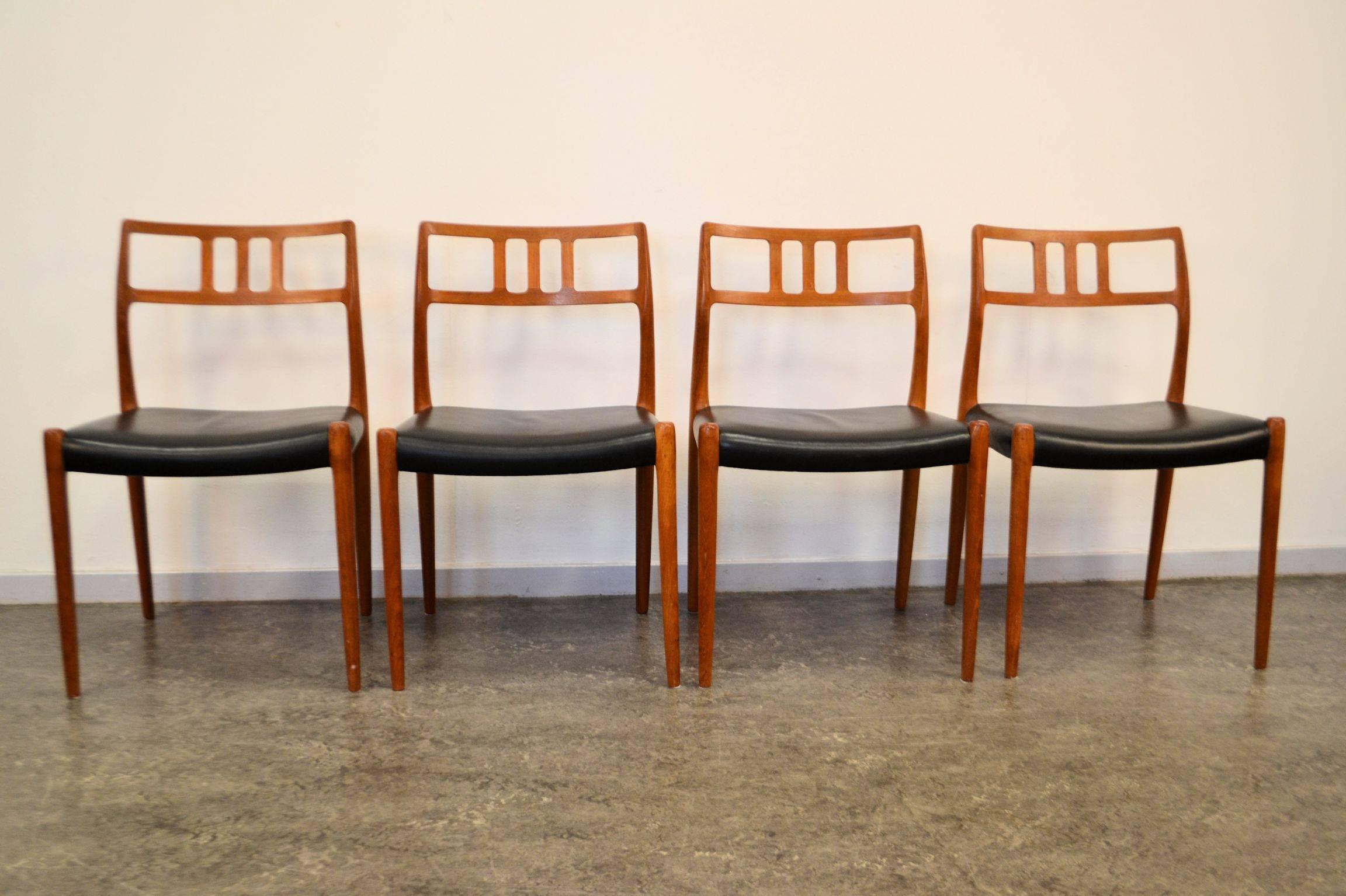 Stylish set of four Danish modern dining chairs. The chairs are designed by Niels O. Møller for JL Møller Møbelfabrik in Denmark. These “no. 79” chairs feature organic design, beautiful black leather upholstery.