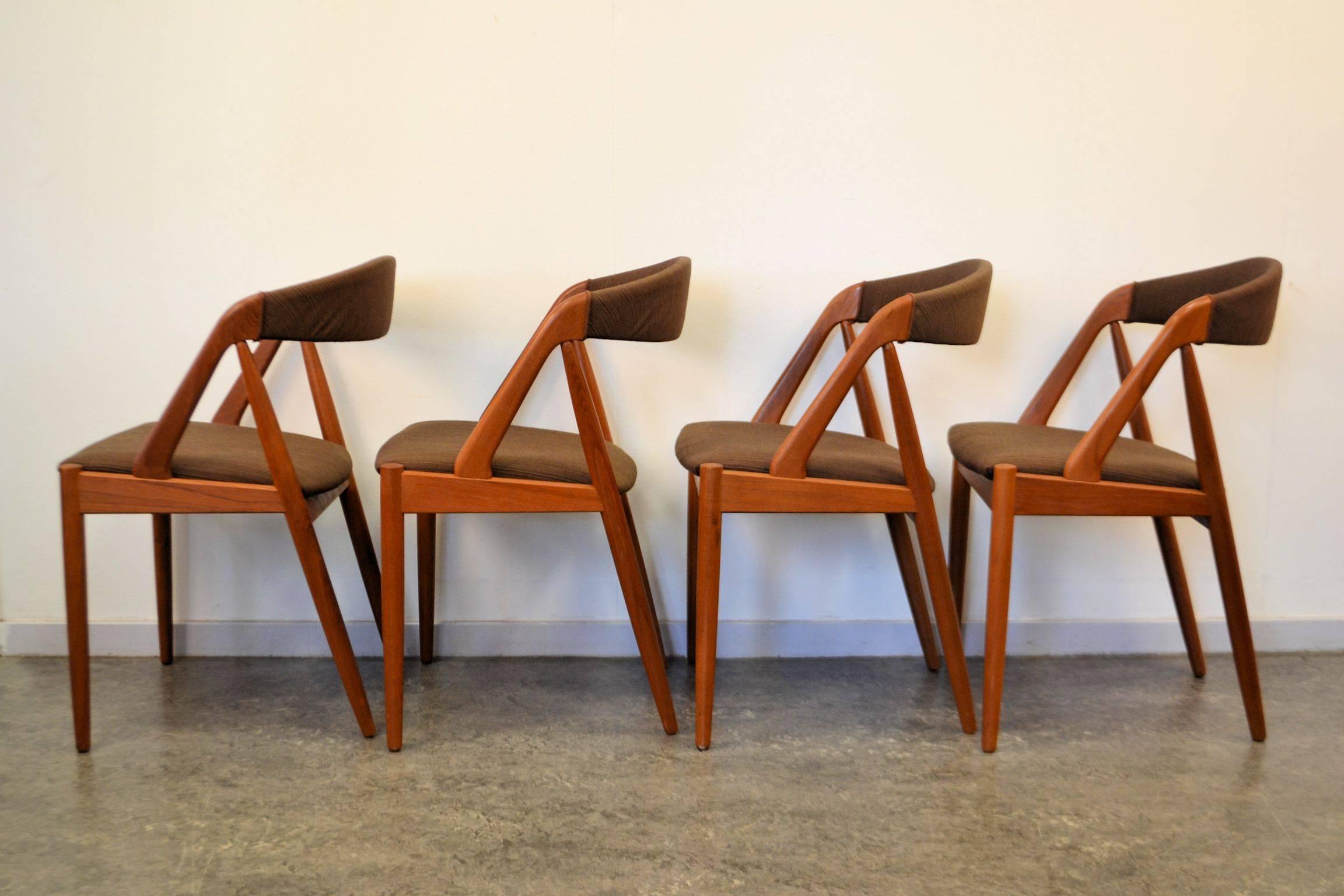 Set of four Danish Modern Kai Kristiansen model #31 dining chairs. Designed in the 1950s for Schou Andersen Møbelfabrik. Kai Kristiansen became worldwide known and celebrated for his iconic dining chair designs. The model 31 is no exception: the