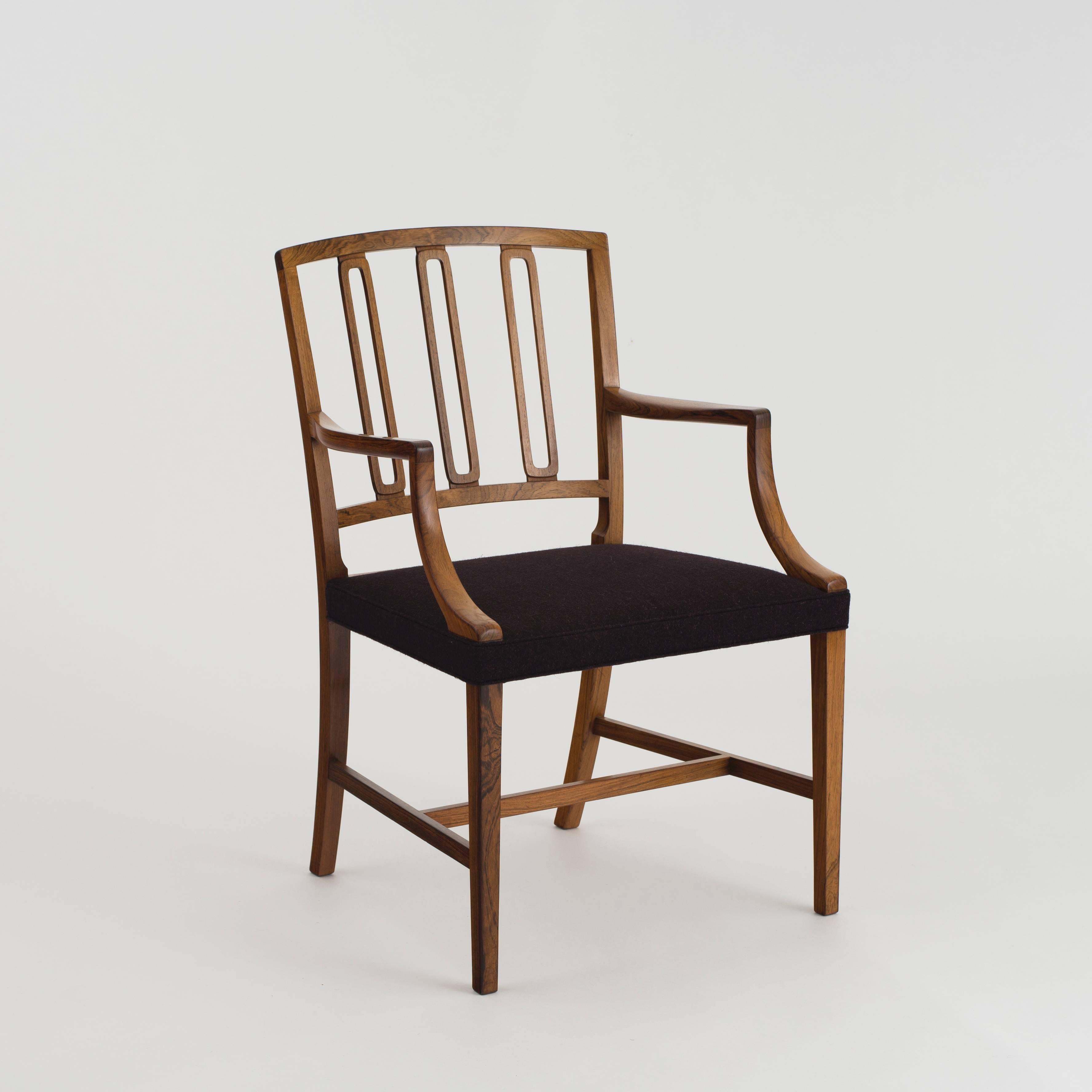 Jacob Kjaer, armchair.

Rosewood and fabric.

Executed by Jacob Kjaer, Copenhagen, Denmark, 1951.
  