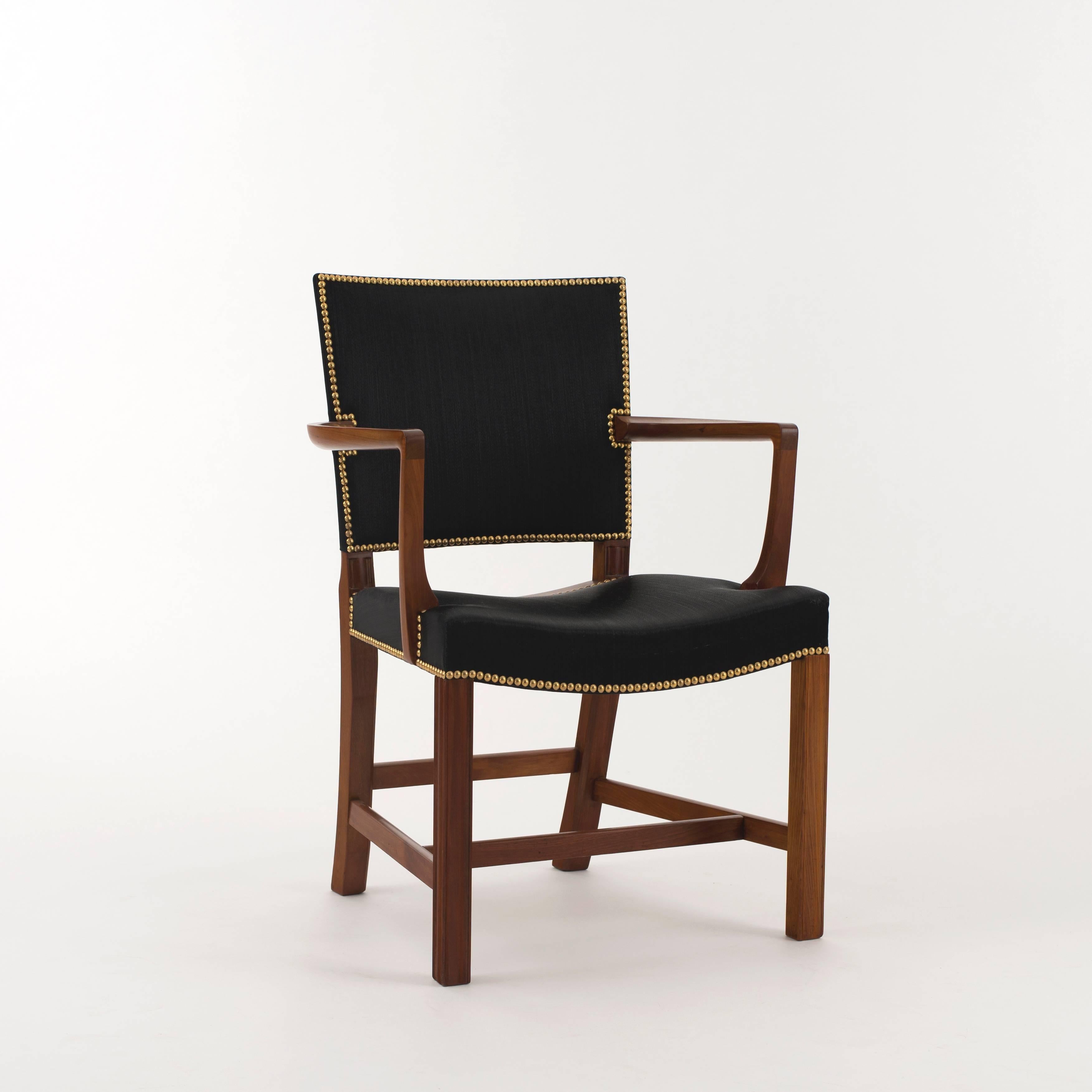 Kaare Klint 'red chair' in Cuban mahogany. Upholstered with black horsehair and brass nails. Executed by Rud. Rasmussen, 1934-1938.

Underside with manufacturer's paper label RUD. RASMUSSENS/SNEDKERIER/45 NØRREBROGAD/KØBENHAVN, pencilled serial