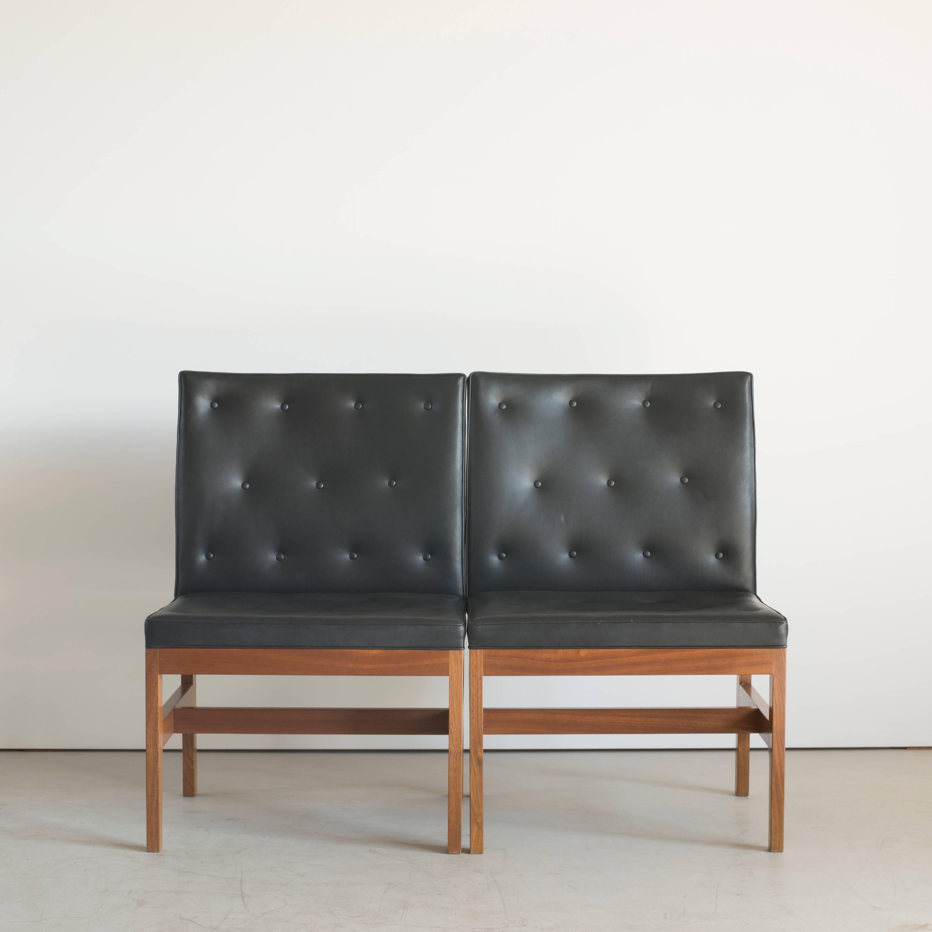 A pair of additional chairs by Mogens Koch. Executed by Rud. Rasmussen.

Mahogany and black leather. 

The reverse with paper labels ‘RUD. RASMUSSENS/SNEDKERIER/COPENHAGEN/DENMARK.