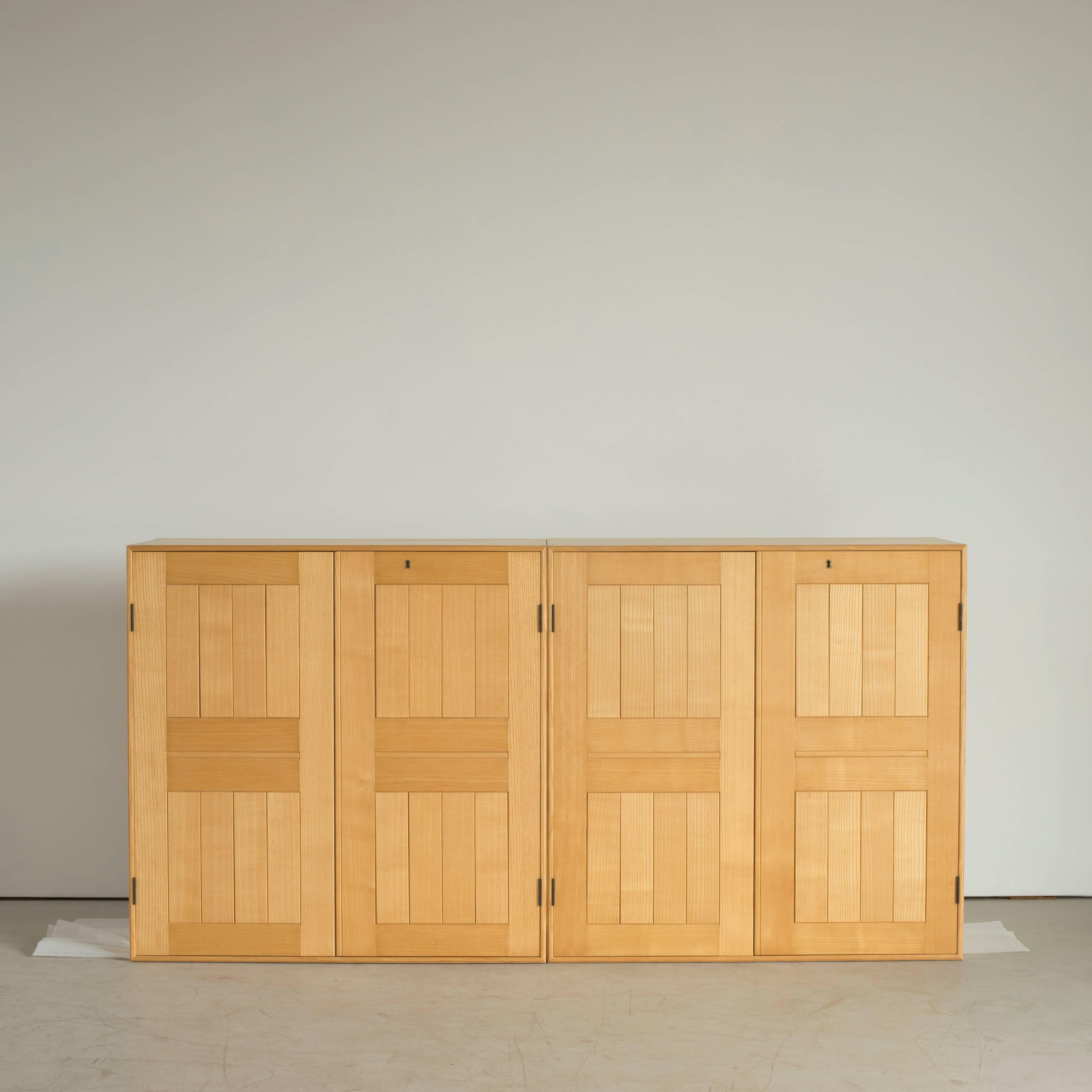 Two cabinets in ash by Mogens Koch. Executed by Rud. Rasmussen.

Reverse with paper labels ‘RUD. RASMUSSENS/SNEDKERIER/COPENHAGEN/DENMARK.