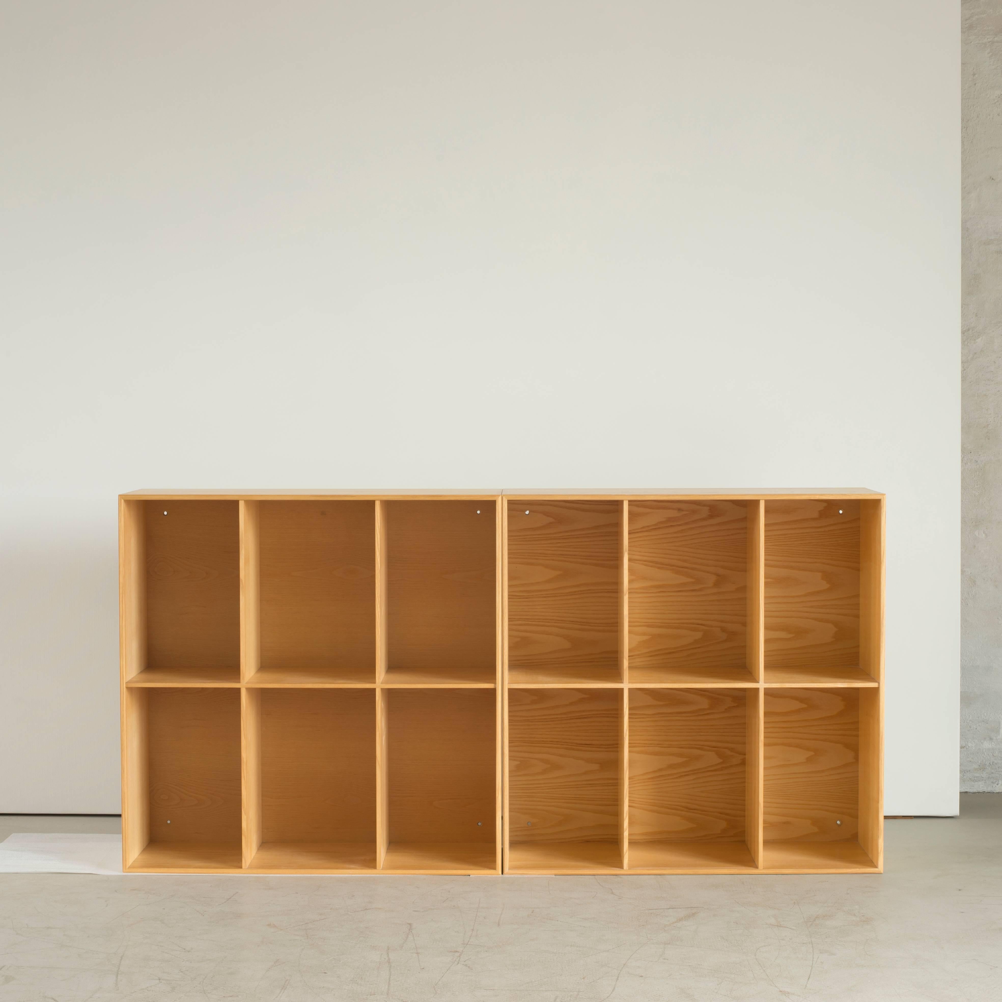 Two bookcases in Ash by Mogens Koch. Executed by Rud. Rasmussen.

Reverse with paper labels ‘RUD. RASMUSSENS/SNEDKERIER/COPENHAGEN/DENMARK.