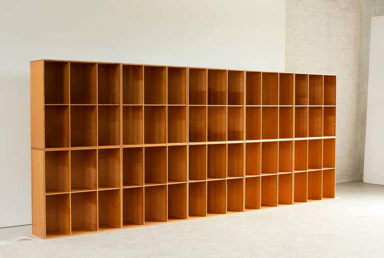 Set of ten bookcases in Oregon pine by Mogens Koch. Executed by Rud. Rasmussen.

Reverse with paper labels ‘RUD. RASMUSSENS/SNEDKERIER/KØBENHAVN/DENMARK.

Cabinets and bases are also available.
