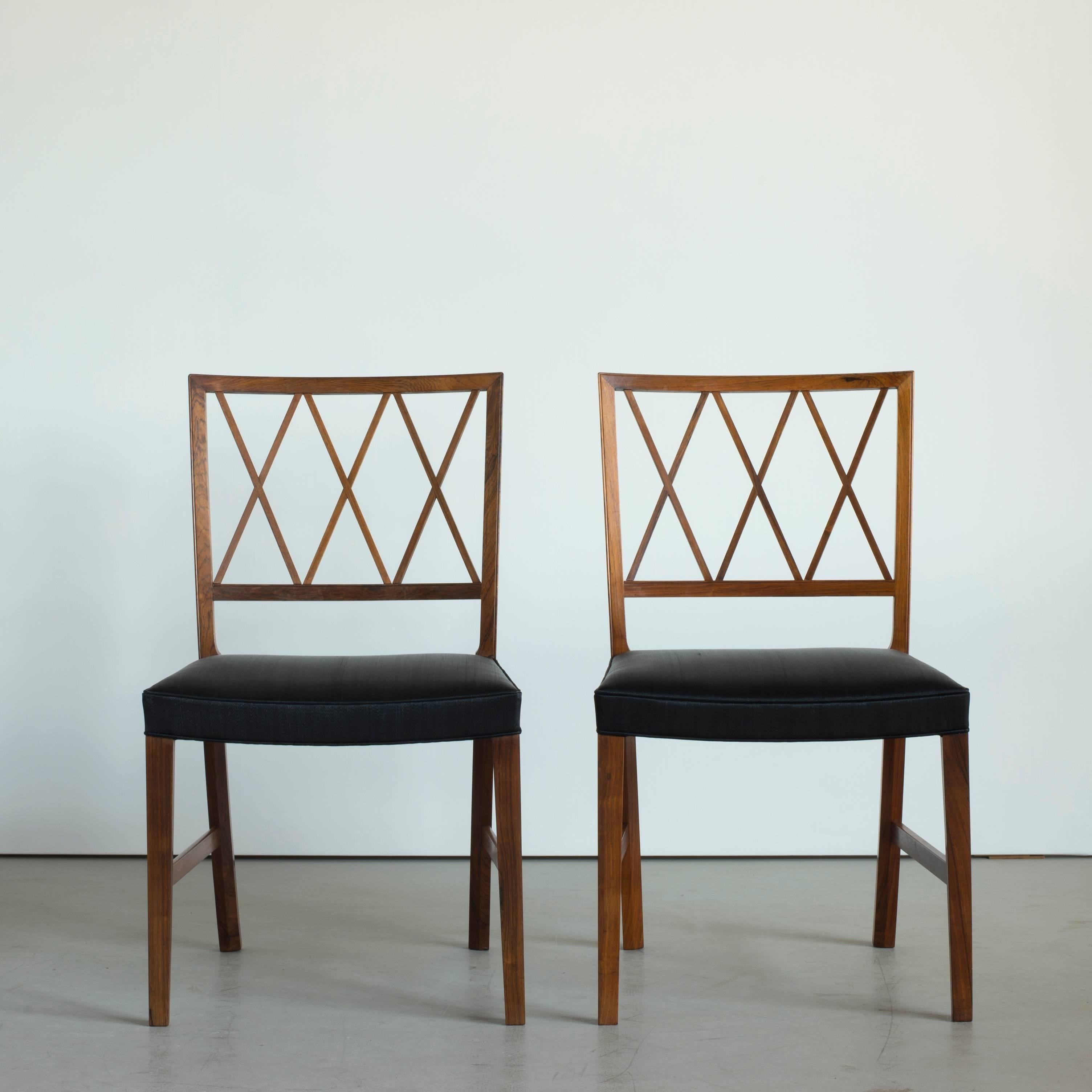 Set of six dining chairs by Ole Wanscher. Executed by A. J. Iversen for Illums Bolighus, Copenhagen.

Rosewood and black horsehair.

12 chairs and matching dining table available.
