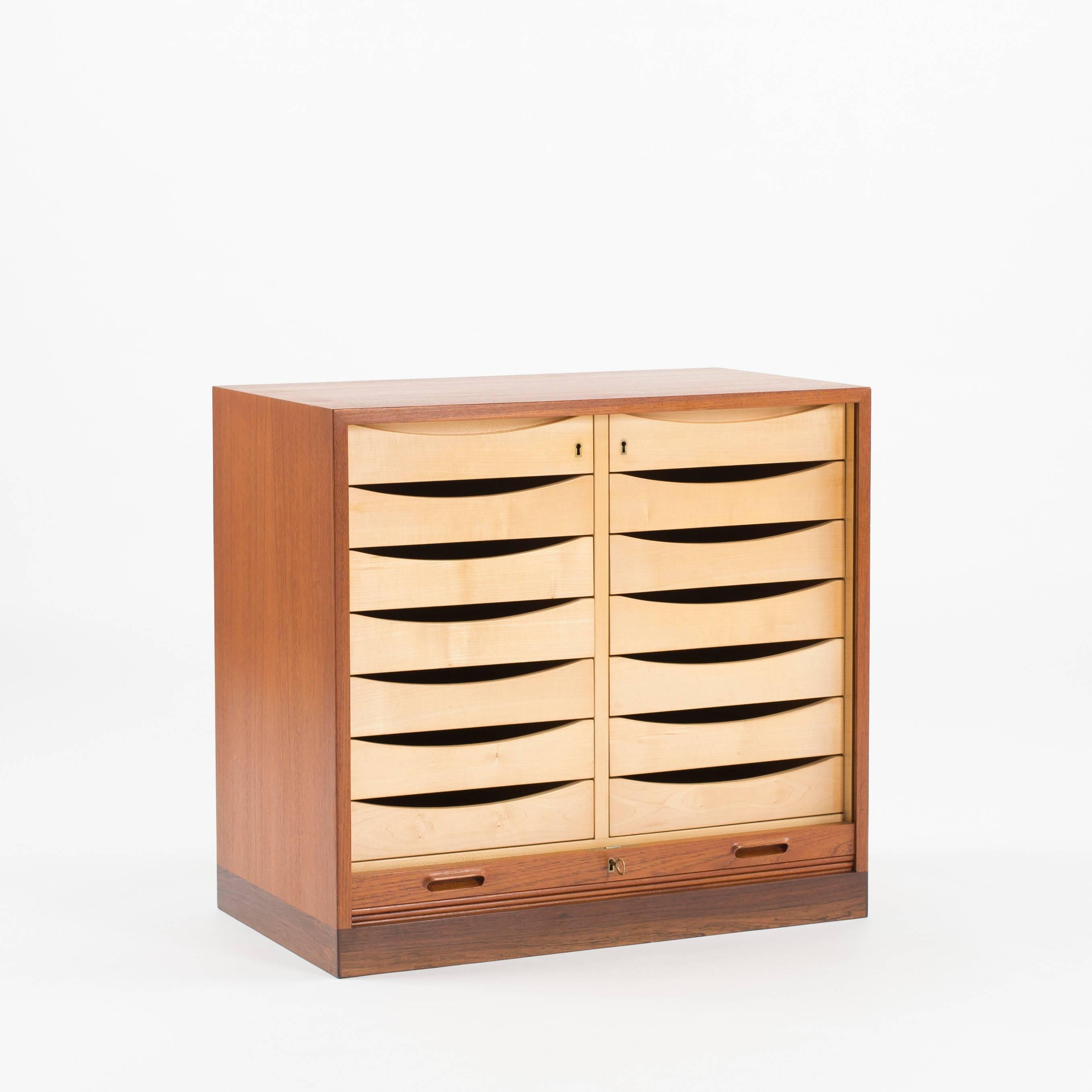 Cabinet with drawers by Ejner Larsen and Aksel Bender Madsen. Executed by Willy Beck, Copenhagen, Denmark.

Teak, Rosewood and Maple.