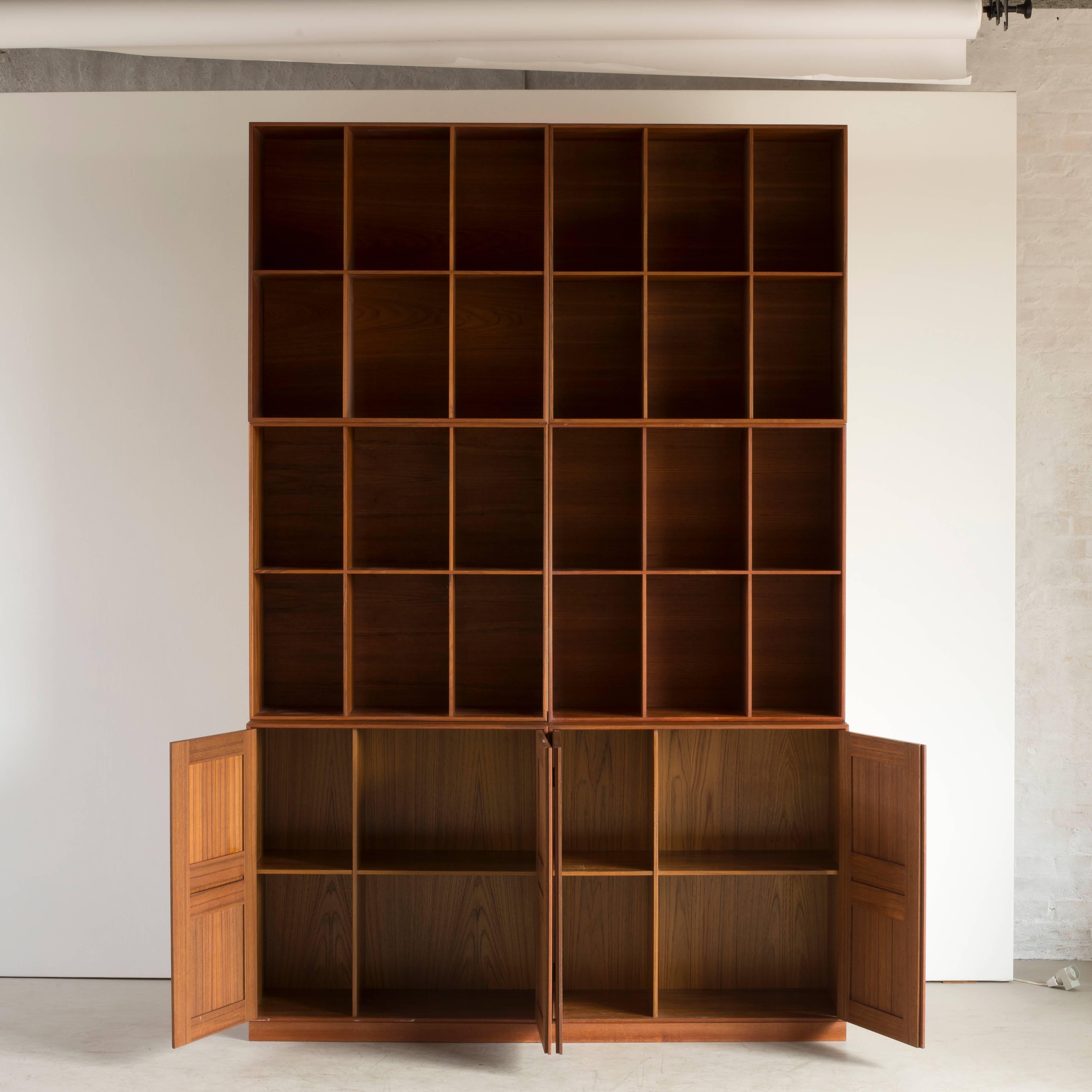 Mogens Koch cabinets and bookcases in Teak.  Executed by Rud. Rasmussen.

Reverse with paper labels ‘RUD. RASMUSSENS/SNEDKERIER/KØBENHAVN/DENMARK.