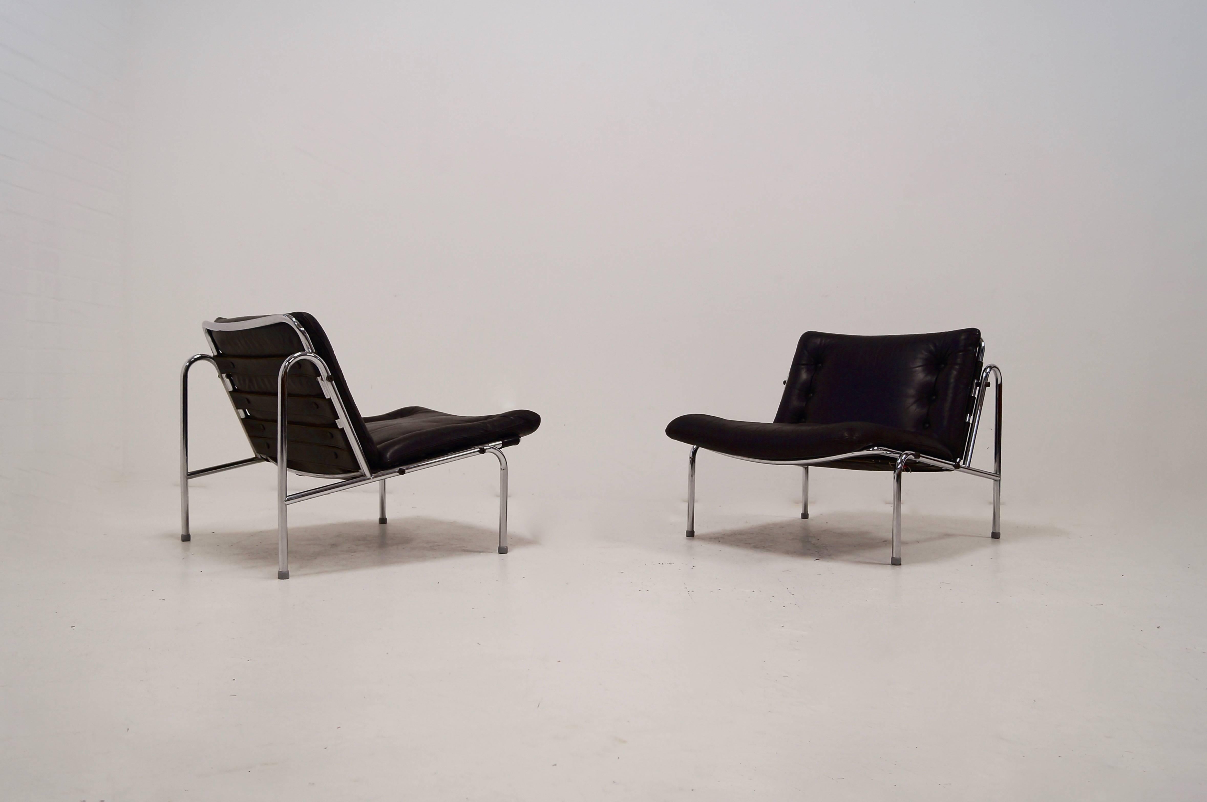 Pair of Kyoto SZ07 lounge chairs designed by Martin Visser and manufactured by t Spectrum in 1969. They have a heavy chrome plated tubular frame with black leather upholstery. 
The 'Kyoto' chair is part of the 'Osaka series' designed for the world
