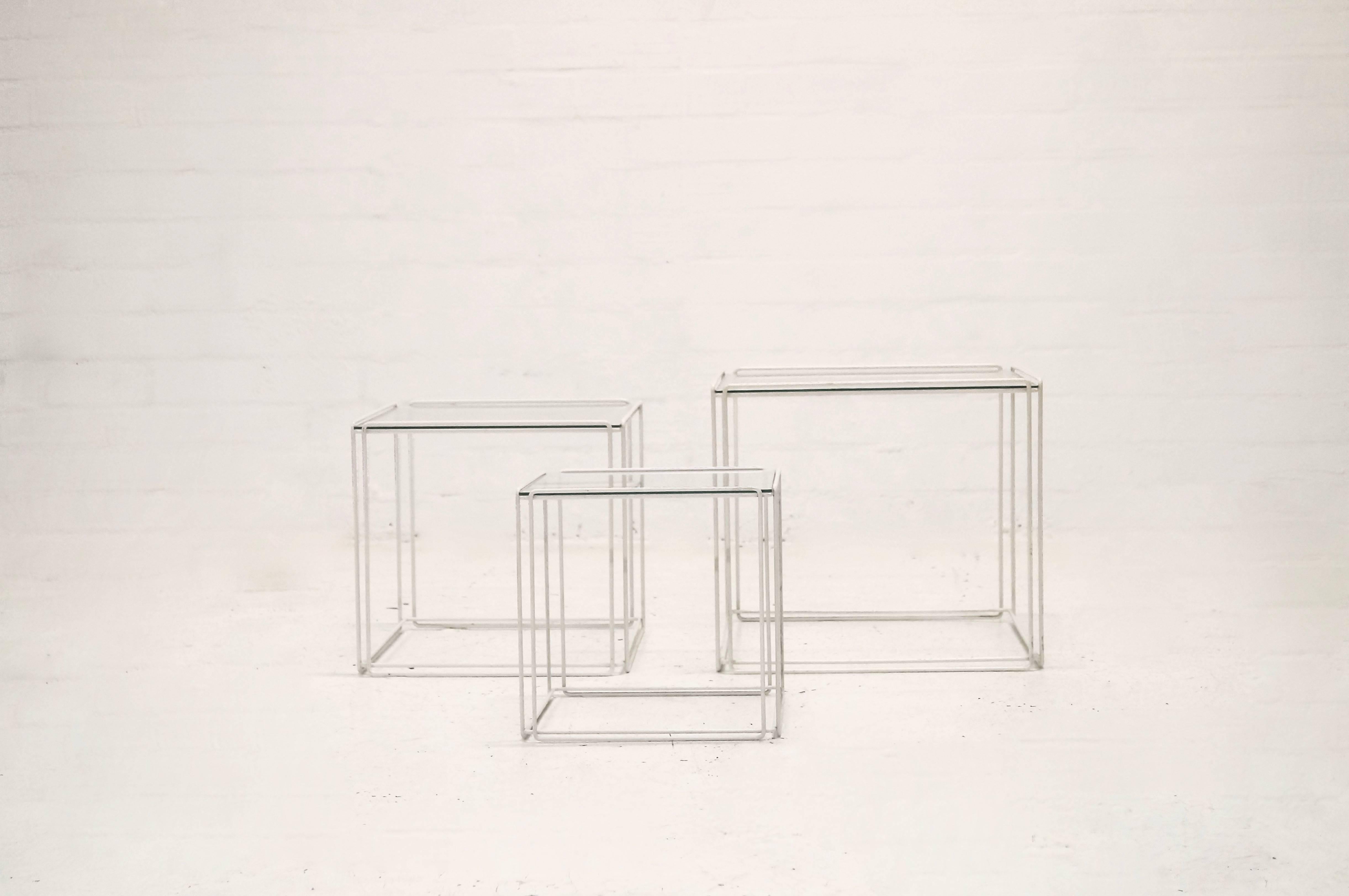 Set of three 'Isocèle' nesting tables designed by Max Sauze in the 1970s. White lacquered metal and glass.