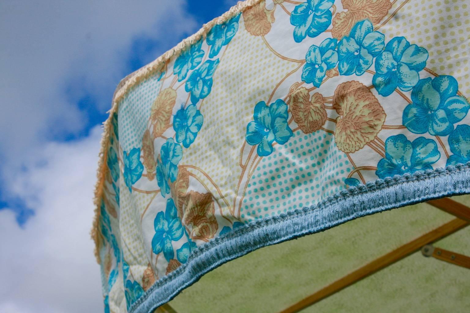 You are viewing 'Dance Me To the End of Love' one of Sunbeam Jackie's iconic sun umbrellas. 
This patio umbrella made using a unique combination of vintage fabrics from legendary British textile houses including Designers Guild and Sanderson. See