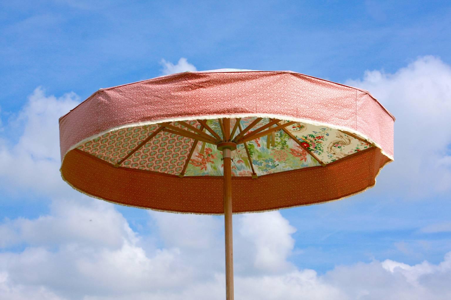 Sunbeam Jackie's iconic contemporary parasols are unique one-off pieces, each parasol is made using it's own selection of heritage textiles. Displayed on Sunbeam Jackie's specially-crafted ash parasol frame, these parasols are objects of
