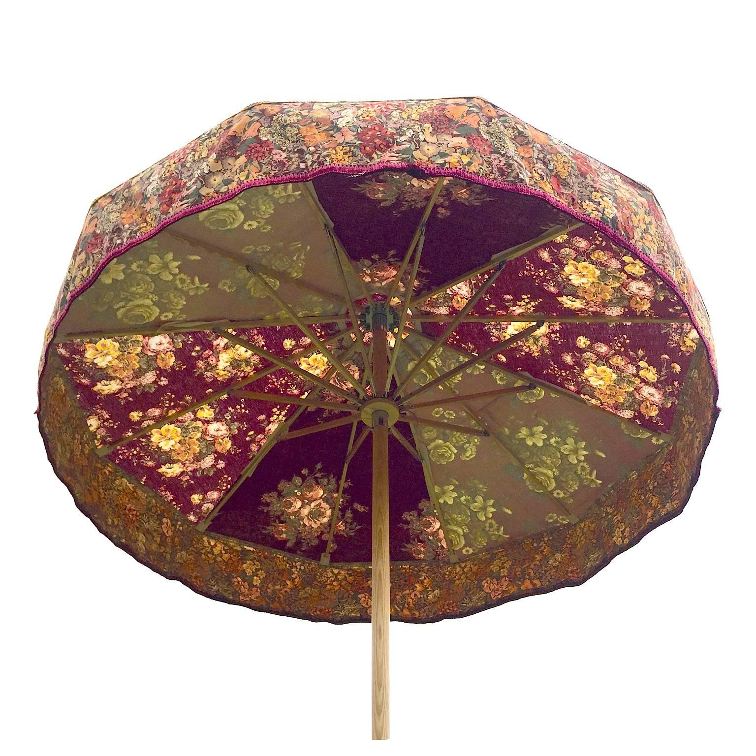 You are viewing 'Scarlet Pimpernel' one of Sunbeam Jackie's iconic sun umbrellas. 
This patio umbrella made using a unique combination of vintage fabrics from legendary British textile houses including Liberty of London and Sanderson. See the