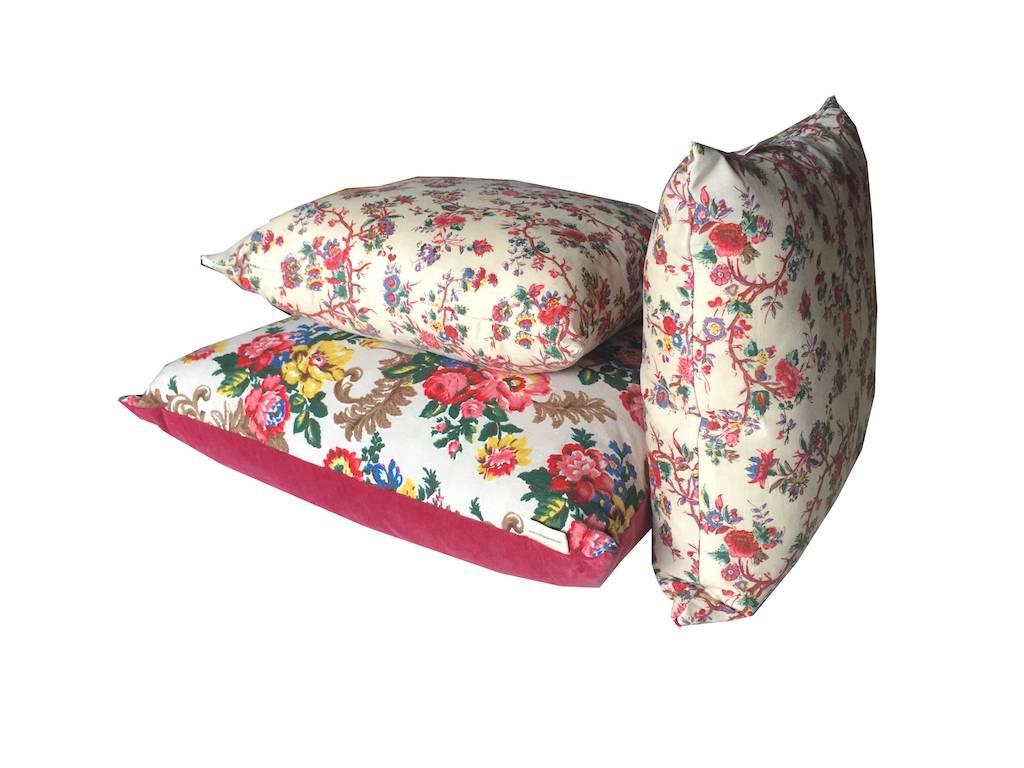 A one-off cushion collection in heritage fabrics, combining an exuberance of textiles including a rare screen-printed fine floral linen, pink velvet and handprinted vintage floral linen; curated and made by the Cornish design duo Charlie and Katy