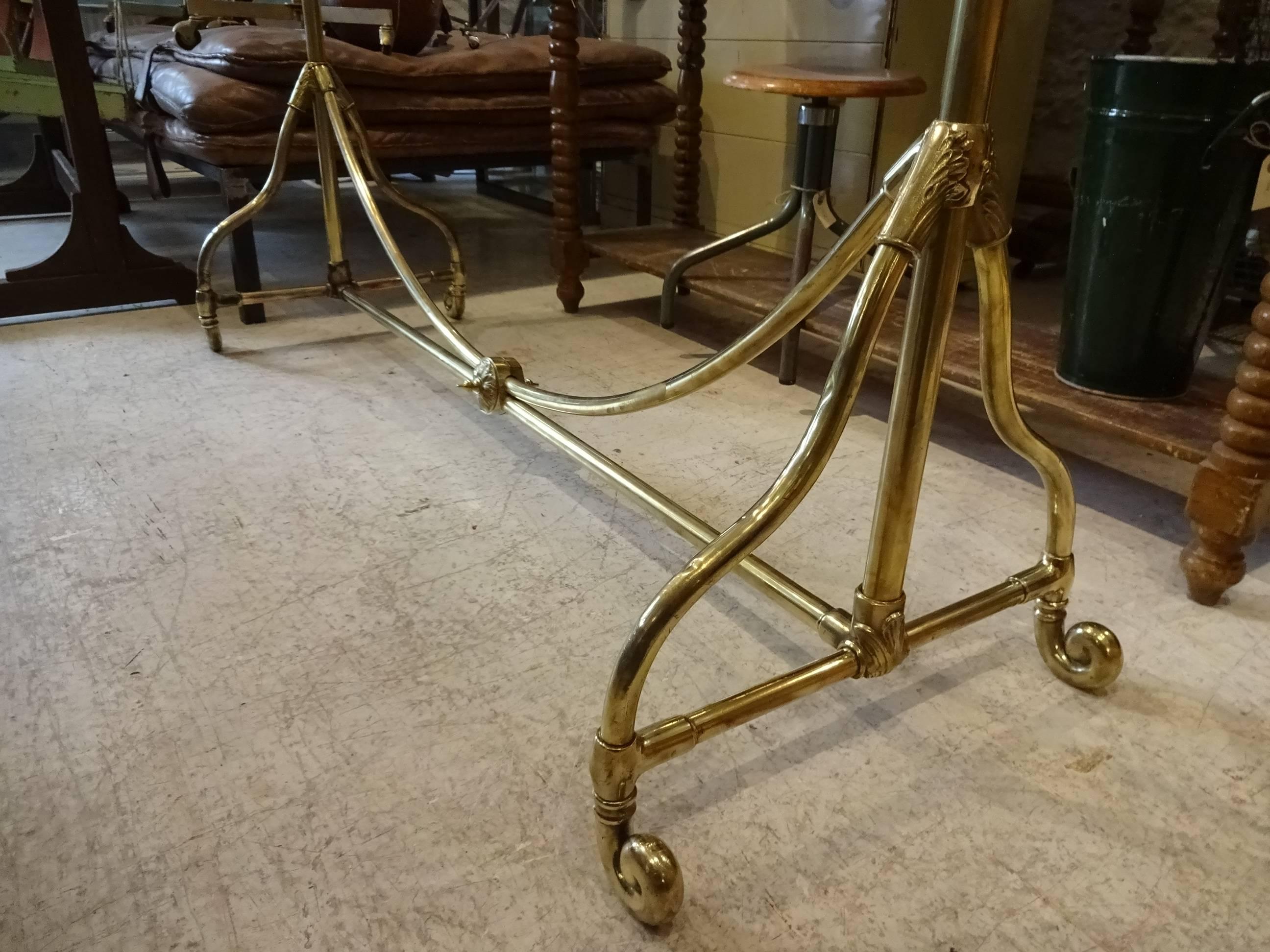 Absolutely fabulous polished old French brass clothes rack with the finest decorative detail. This clothes rack oozes of exclusivity and is a rare find.