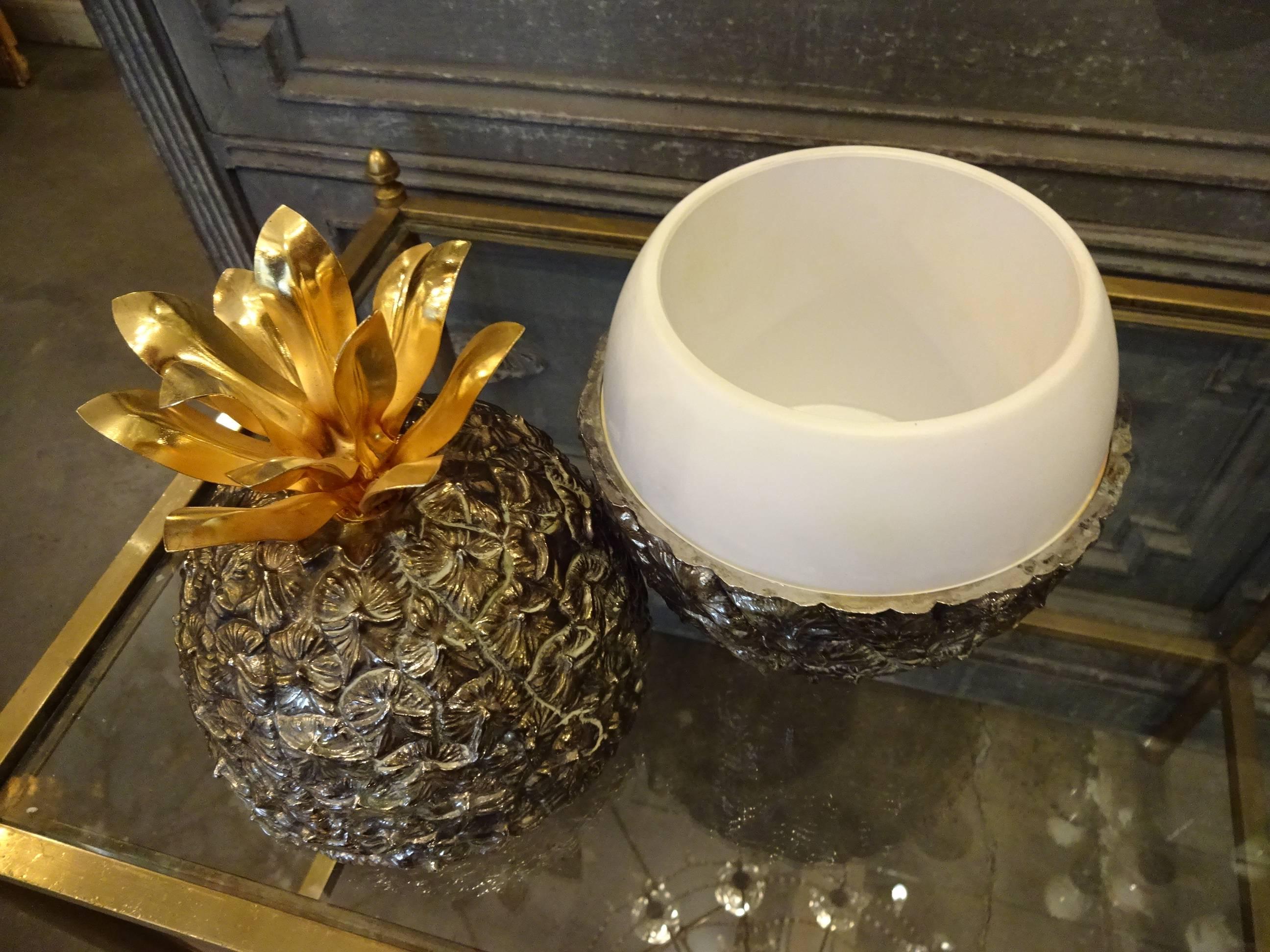 Wonderful French pineapple shaped ice bucket by Michel Dartois, Paris, 1970s. Made of silver-plated metal, plastic container, solid brass base stamped with 'Made in Paris' and Michel Dartois and adorned with beautiful brass leaves on top that serve