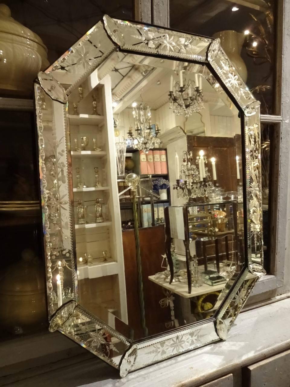 Gorgeous Venetian mirror from 1920s-1940s France, with fabulous cut mirrored glass and etchings.
