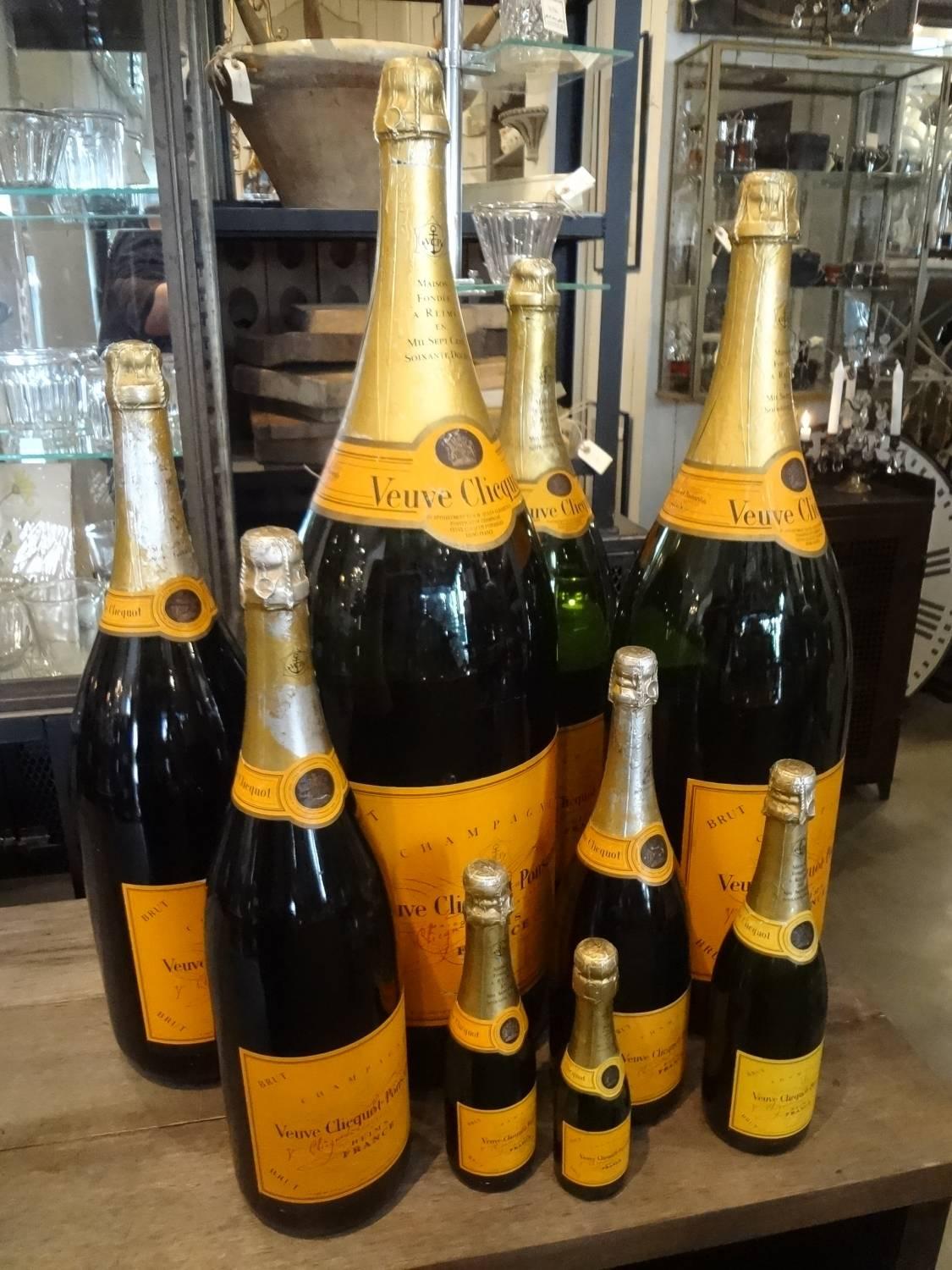 A truly exceptional collection of nine empty champagne bottles representing the House of Veuve Cliquot Ponsardin – otherwise known as ‘The Yellow Widow’. Probably originally used for display purposes at an off license / restaurant. 

The varying