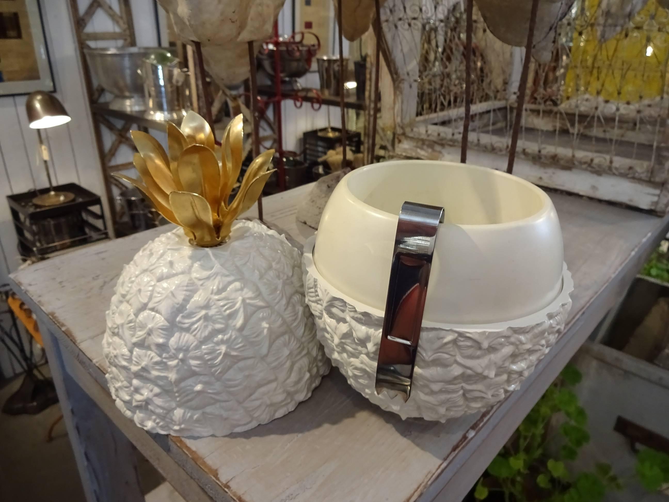 Wonderful French pineapple shaped ice bucket by Michel Dartois, Paris, 1970s. Made of plastic, solid metal base stamped with 'Made in Paris', and adorned with beautiful metal leaves on top that serve as a handle.