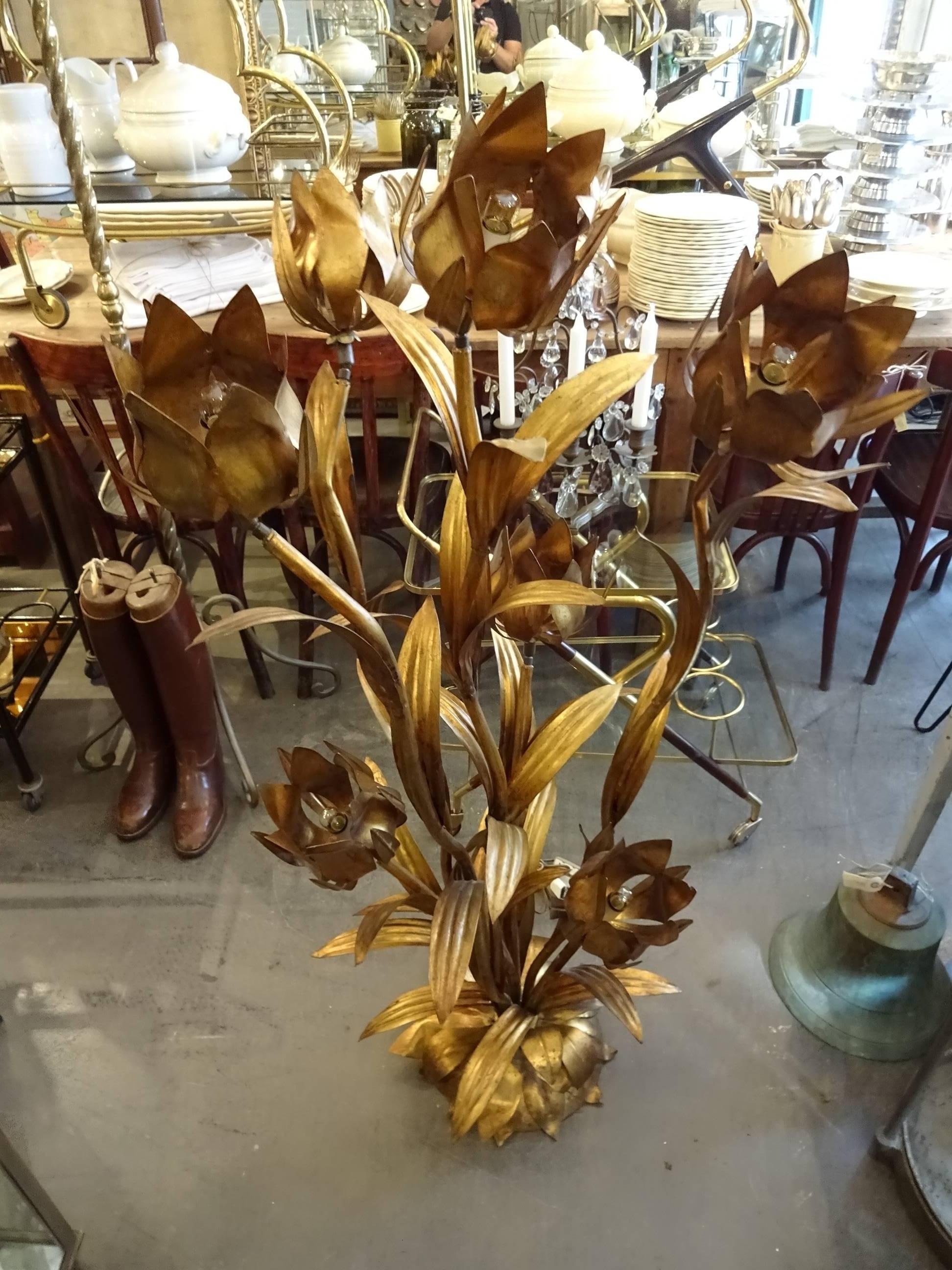 Very cool vintage French floor lamp in gilt brass with ornate flowers, petals and leaves as lights. The lamp has seven light sources, each being adjustable, so you can direct the light as you wish. Super stylish conversation piece.