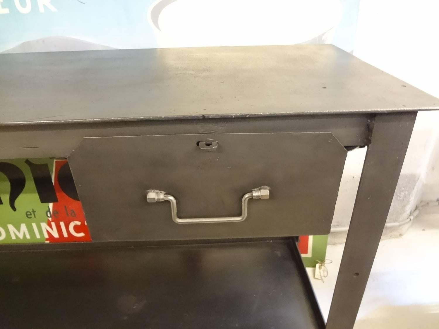 Fantastic old French metal Industrial table, stripped of paint and polished up to a great depth in color.