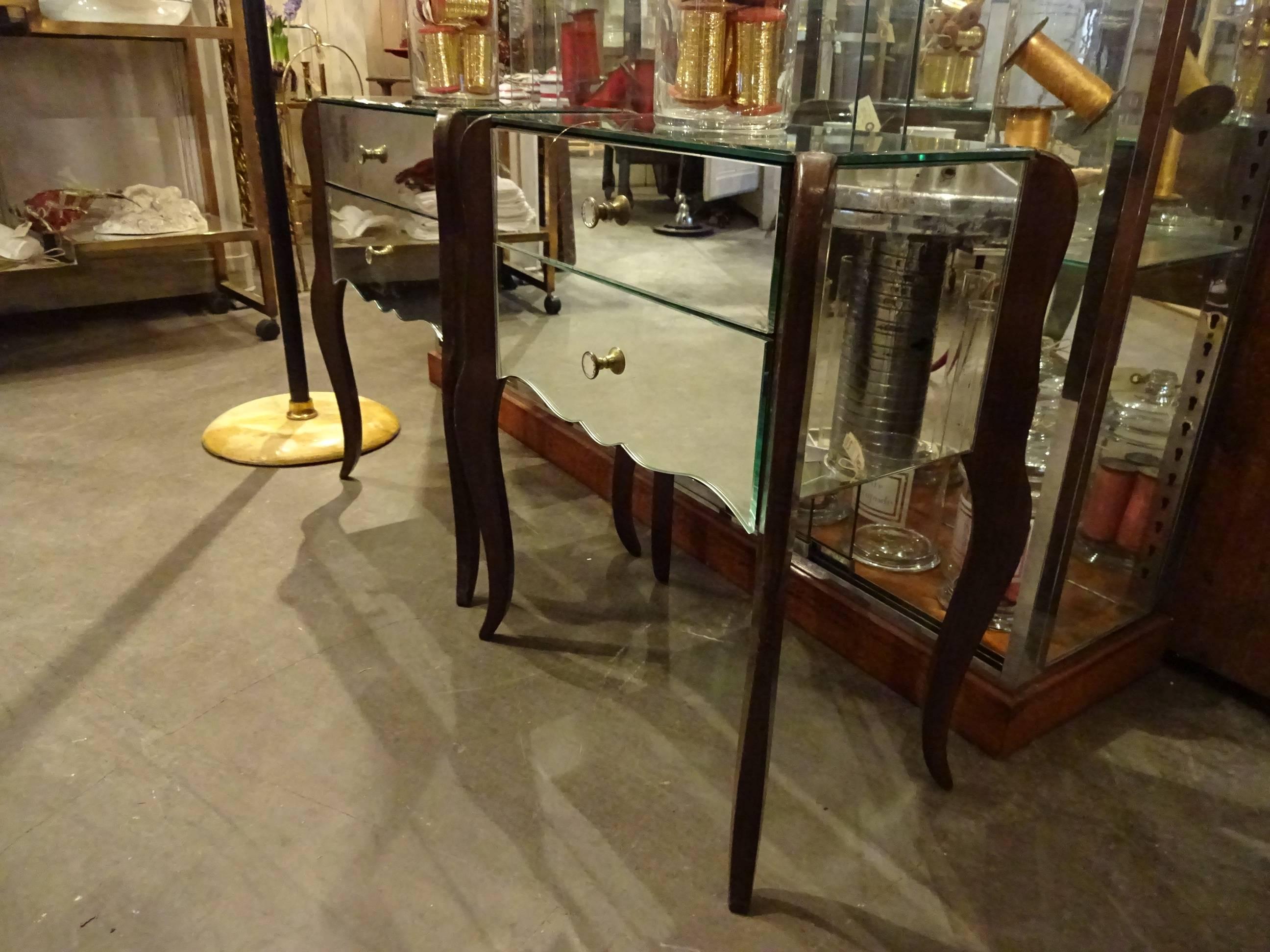 A beautiful and rare pair of French mirrored commodes from the 1940’s. Would be a simply lovely piece of bedroom furnitures, stunning in a hallway or as a side tables.

 
