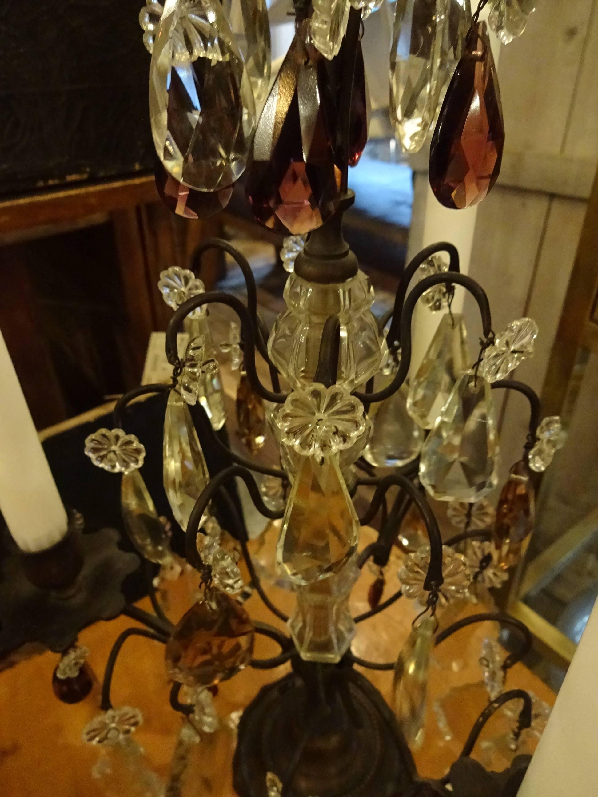 Absolutely breathtakingly beautiful old French bronze and brass candlestick / candelabra, with gorgeous clear and lilac crystal prisms. Each holds three candles and is a real eye-catcher, whether lit or unlit.
