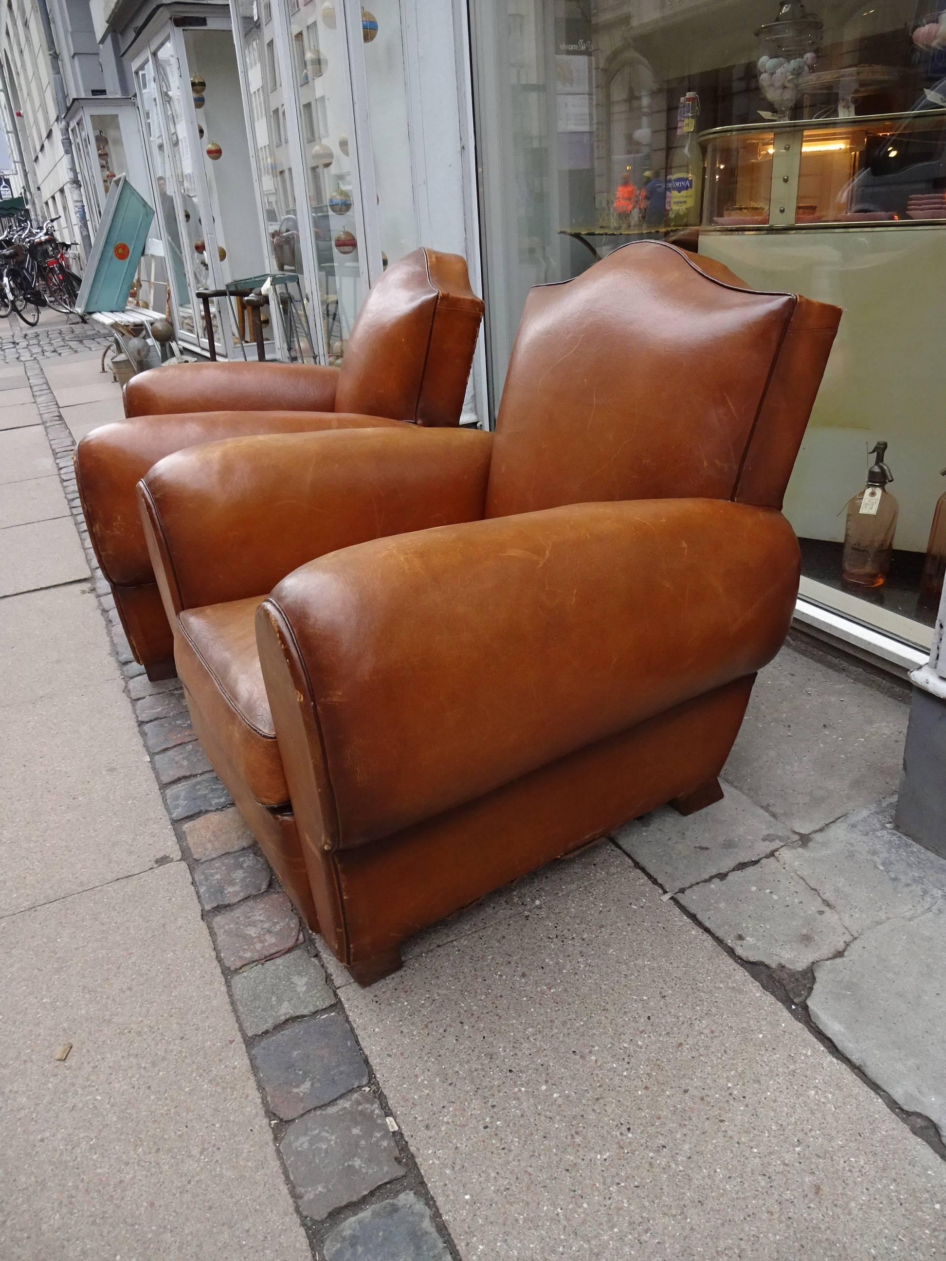 A pair of stunning Classic vintage club chairs from France, where they simply known as ‘clubs’! Beautifully round shapes and delicious patinated leather. Masculine style. Super for a study or boutique hotel lounge.

Measures: H 80 x W 80 x D 80 cm.