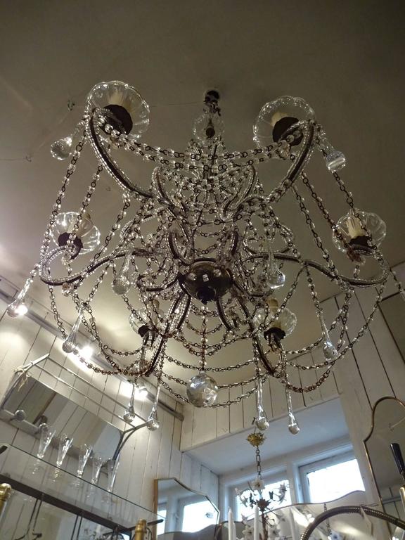 Stunning vintage French chandelier, draped with countless pearl teardrop shaped prisms. The chandelier has seven lights. A lovely statement piece for any room, traditional or modern.

Measures: H 73 x D 60 cm.
  