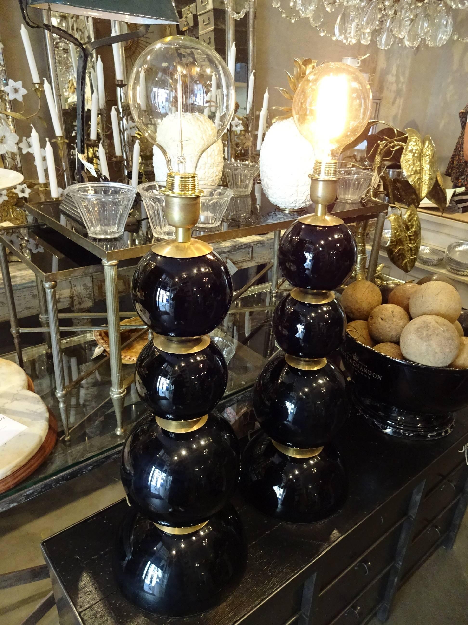 Gorgeous pair of French black Opaline glass and brass table lamps from the 1950-1960s. So stylish.