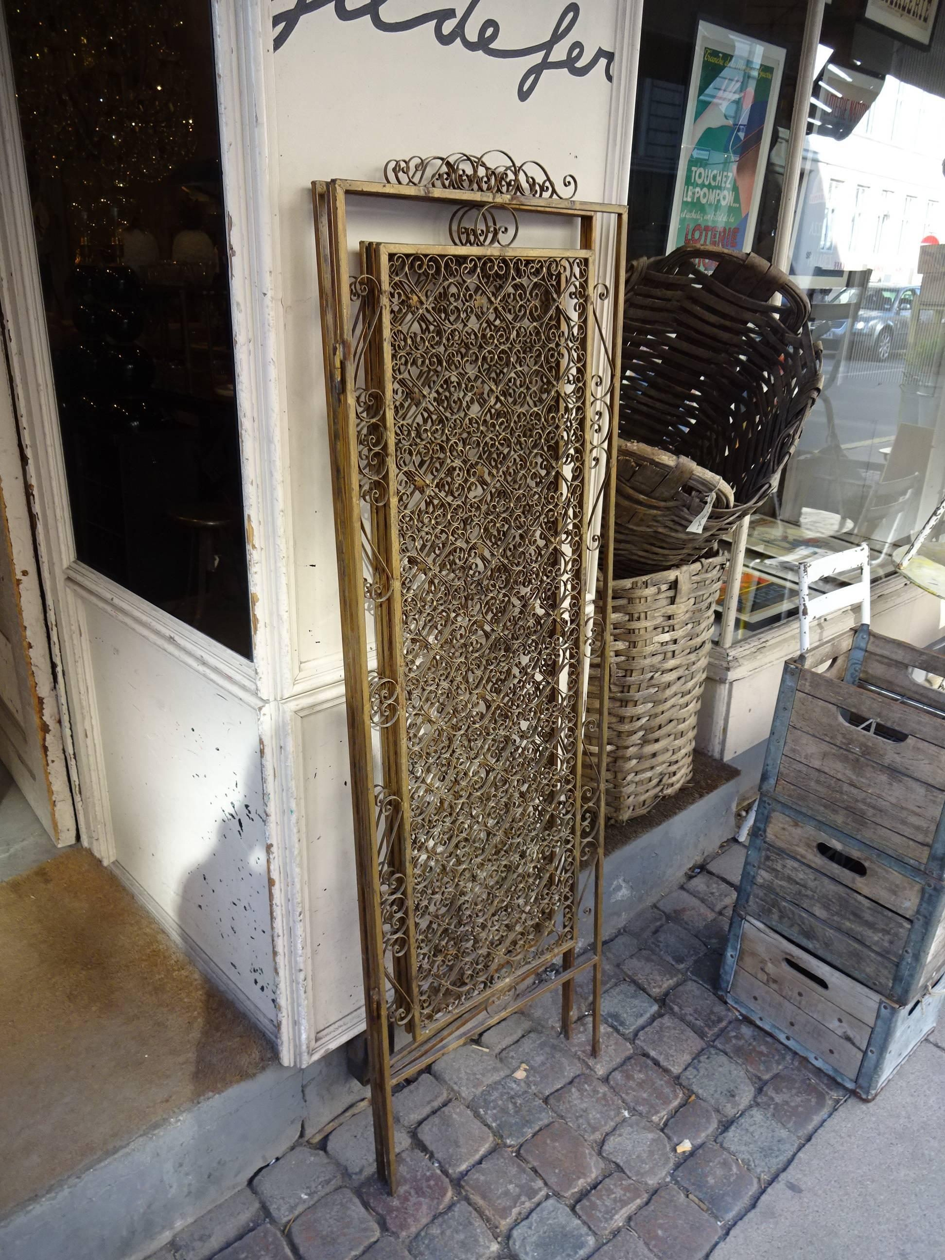 Gorgeous and fantastic vintage French gilt metal screen wall. Three panels with stunning detailed ornamentation. Amazing piece.