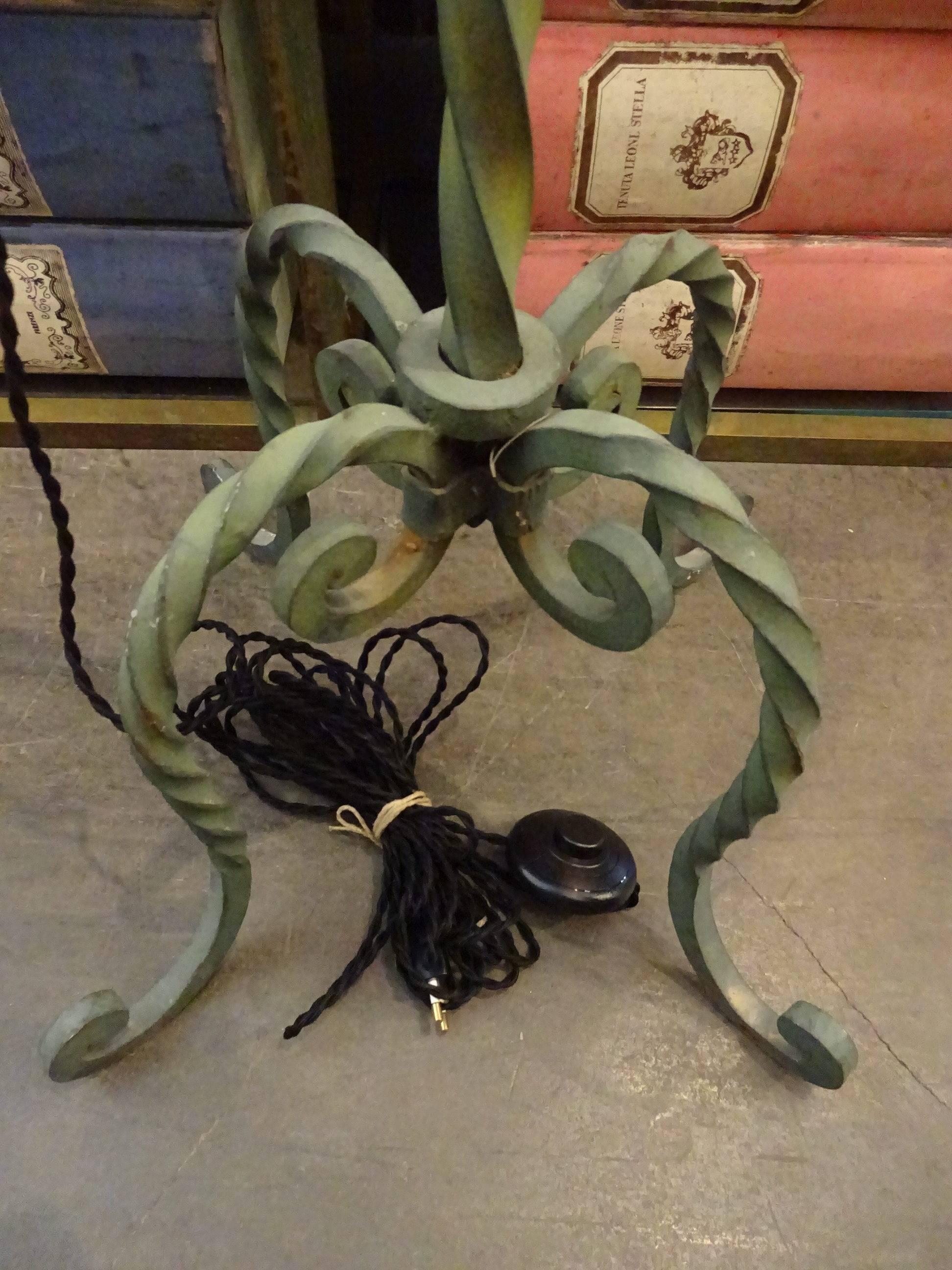 French floor lamp from the 1920s, with beautiful twisted iron frame and iridescent green painting. Can be used with or without lampshade.

 