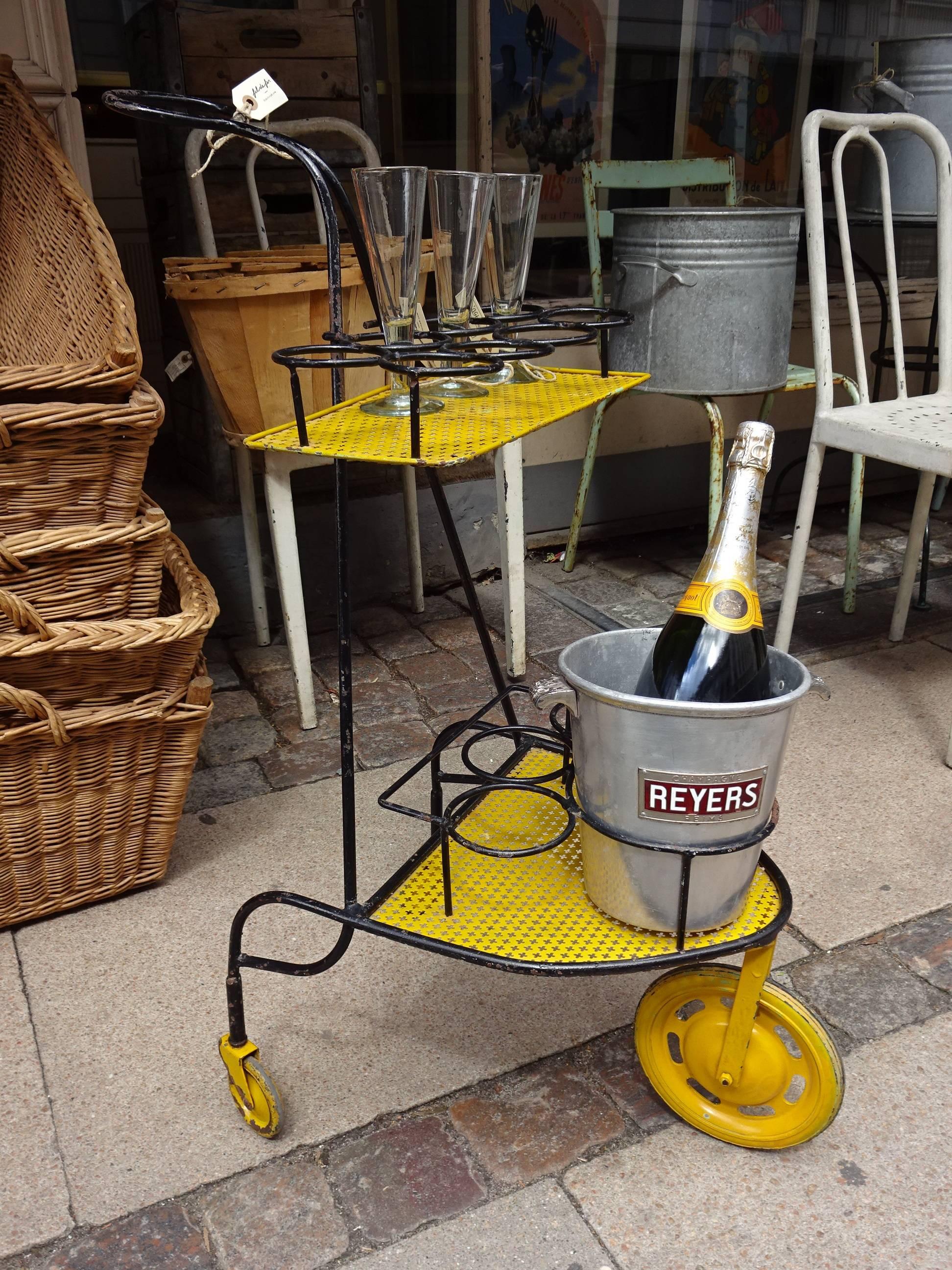 Fabulous black and yellow vintage Matégot style trolley / bar trolley. Designed in the 1950s and has two perforated metal yellow trays to store the ice bucket, bottles and glasses. Super look.
